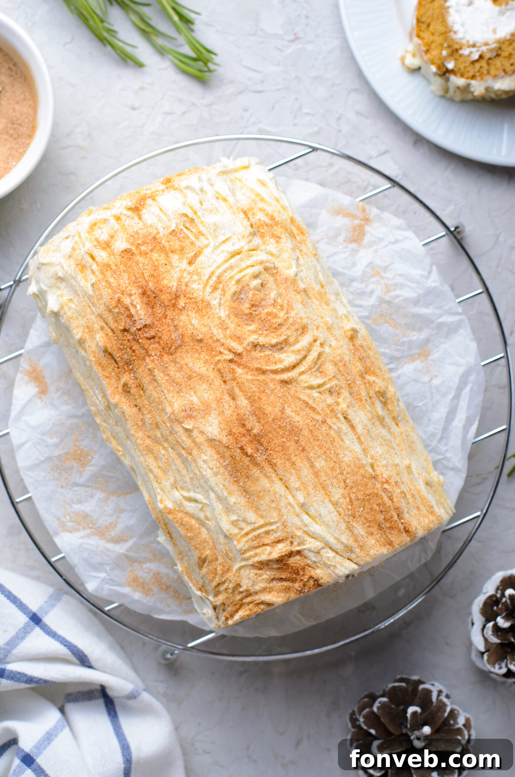 Overhead view of GIngerbread Cake Roll on a wire rack.