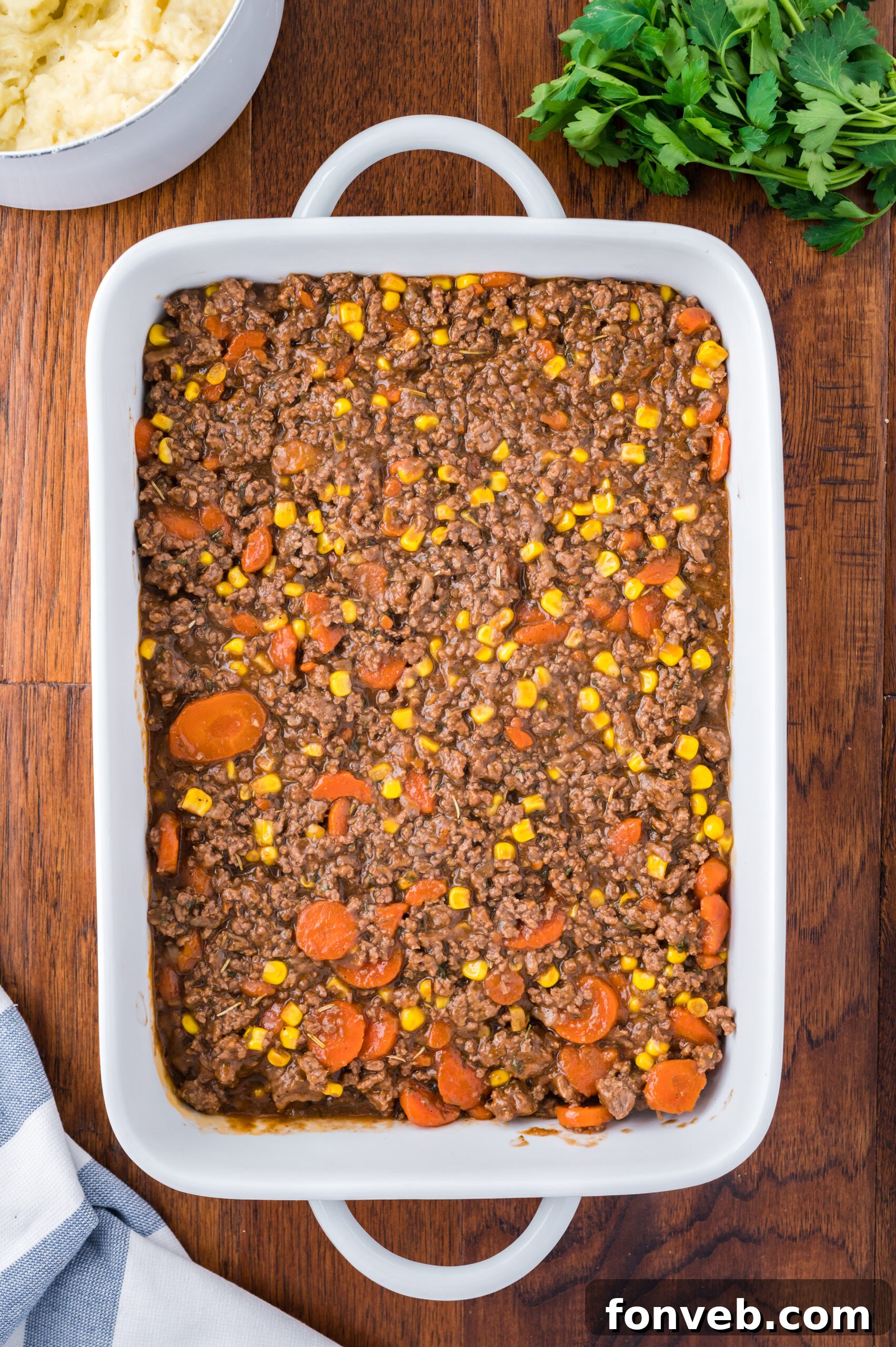 Preparing the savory ground meat filling for the Shepherd's Pie casserole.