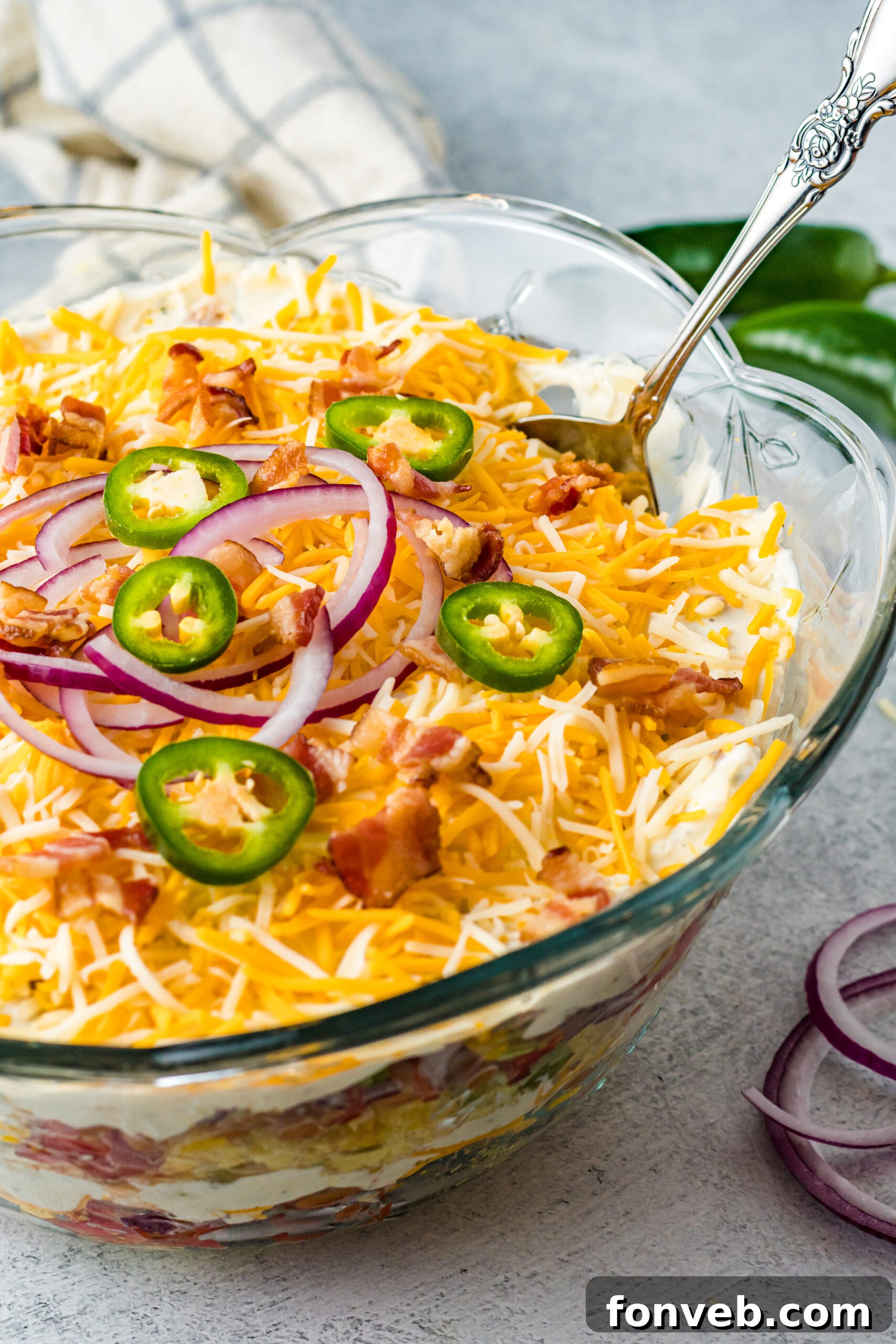 Southern Cornbread Delight 2 Front view of Cornbread Salad in a clear glass bowl.