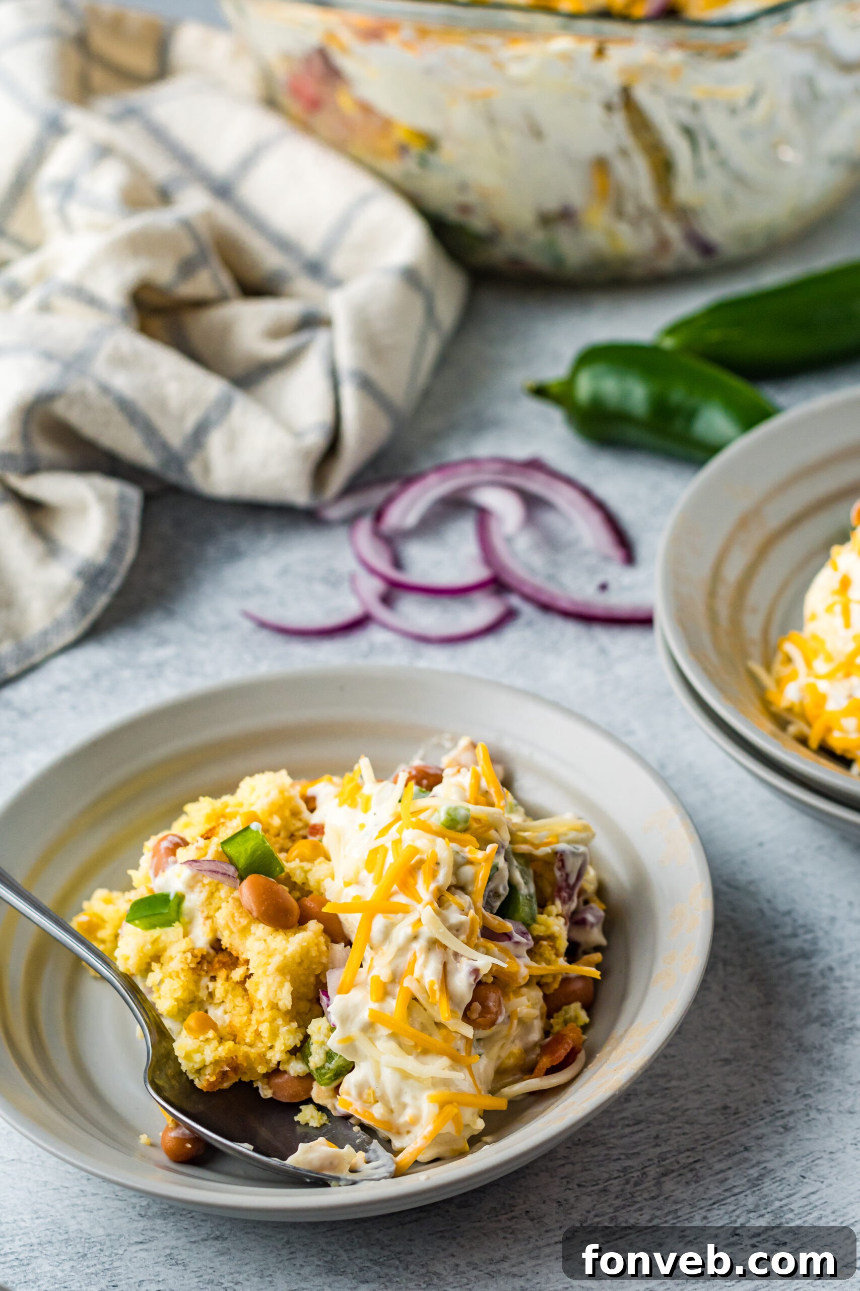 Southern Cornbread Delight 18 Front view of a serving of Cornbread Salad in a gray bowl.