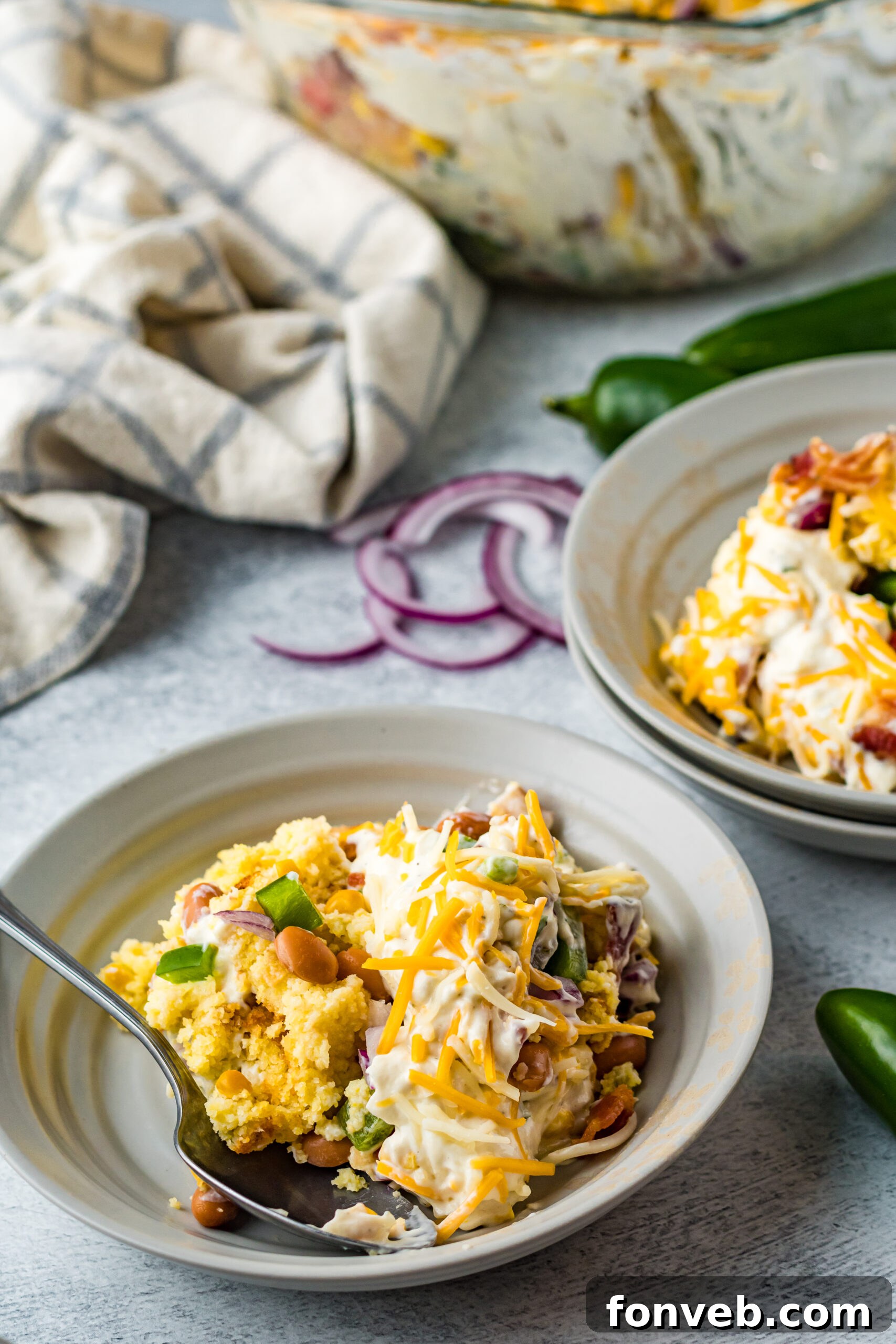 Southern Cornbread Delight 6 Front view of a serving of Cornbread Salad in a gray bowl.
