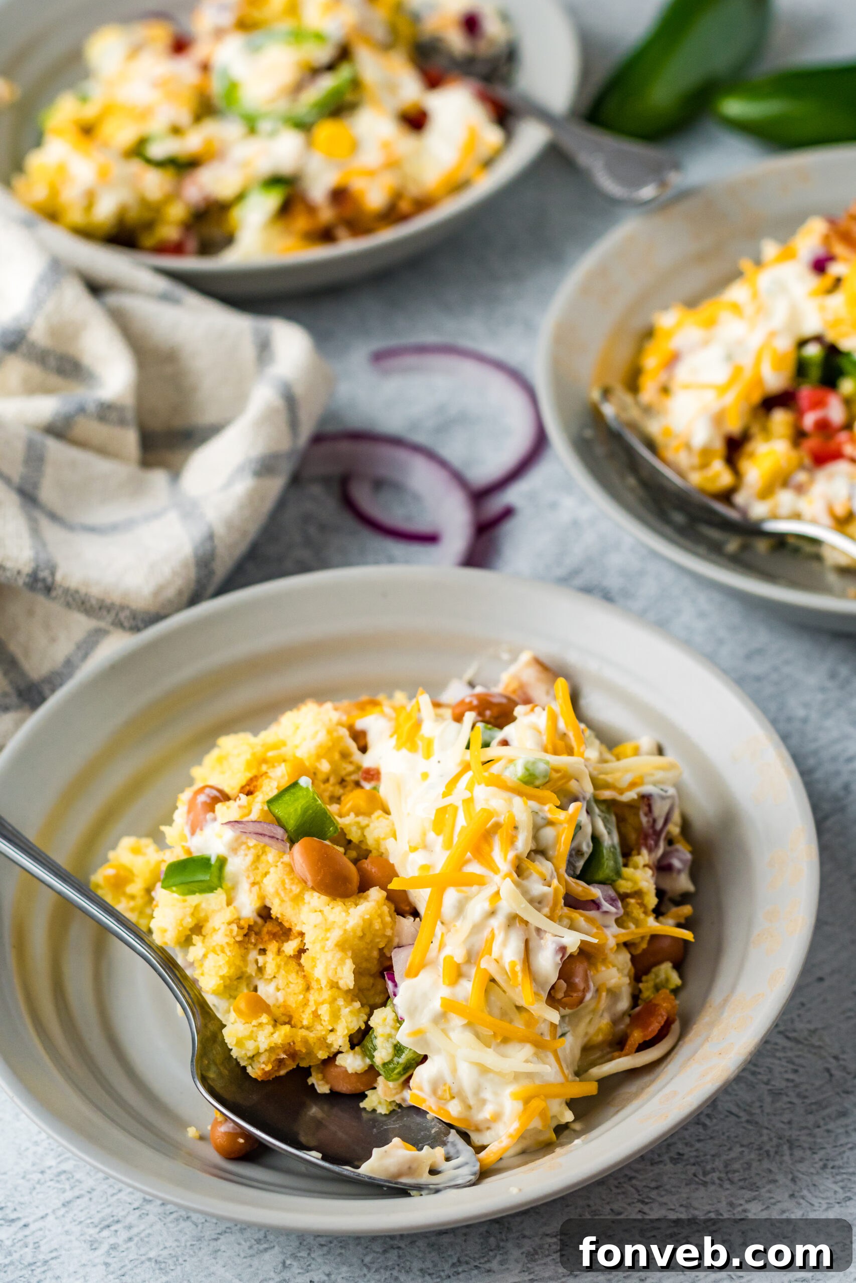 Southern Cornbread Delight 8 Front view of a serving of Cornbread Salad in a gray bowl.