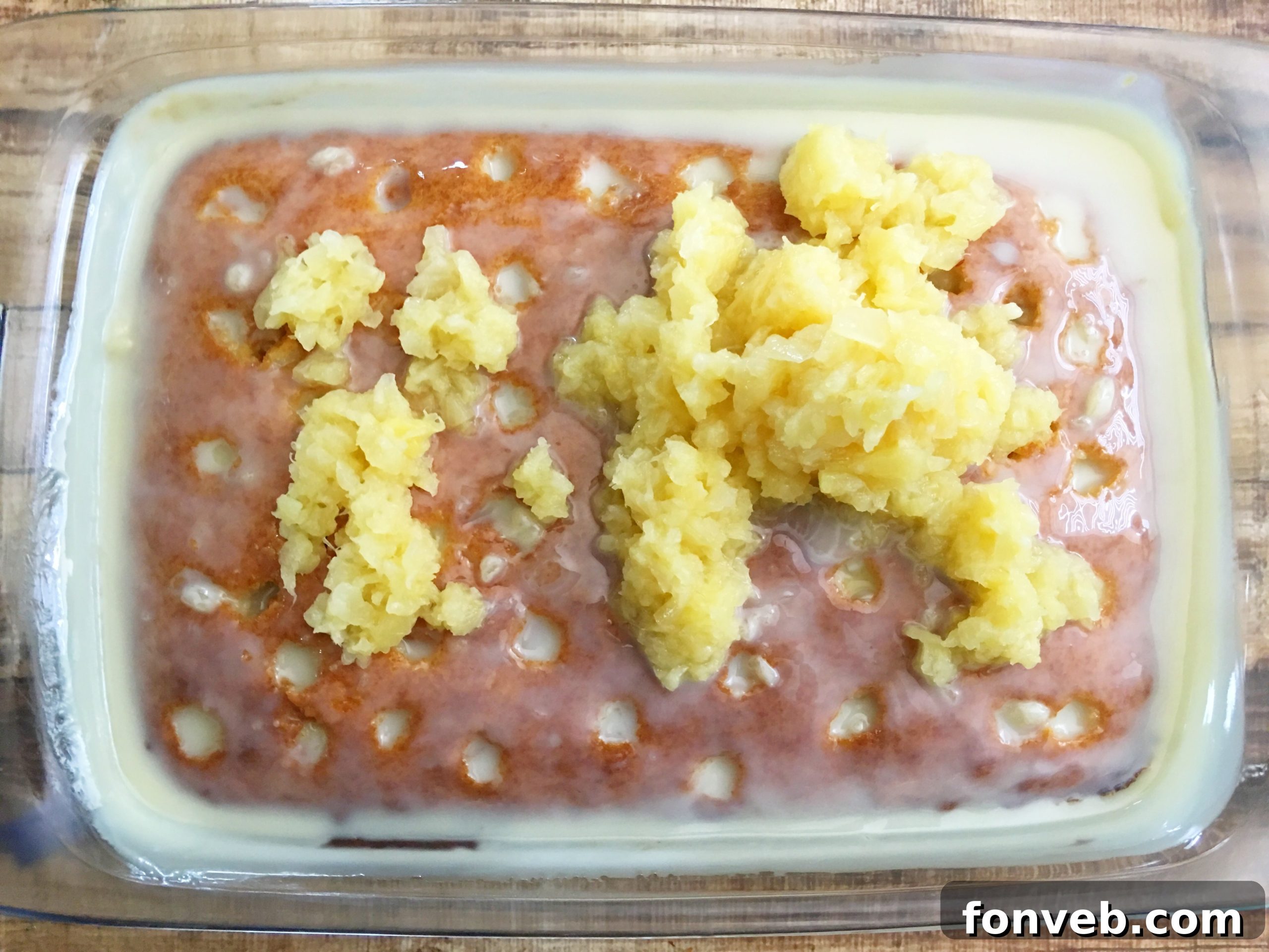 Sweetened condensed milk being poured into a bowl