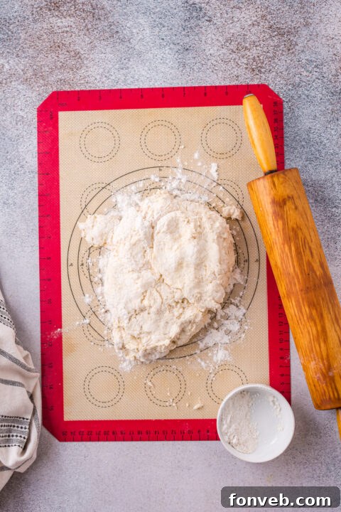 Close-up of biscuit dough being prepared.