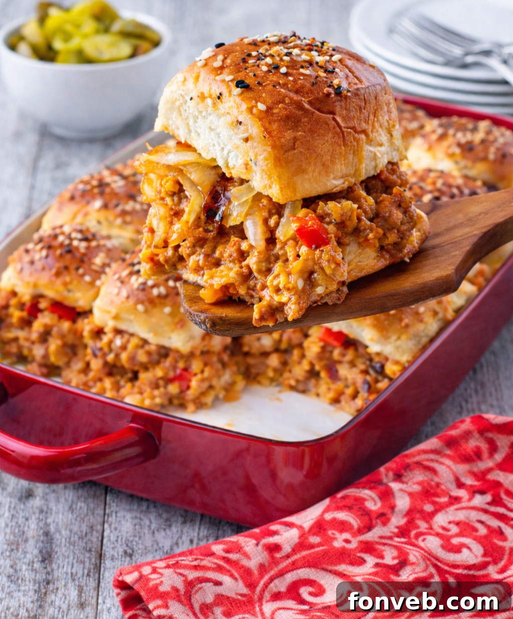 Cheesy Chicken Sloppy Joe Sliders presented attractively.