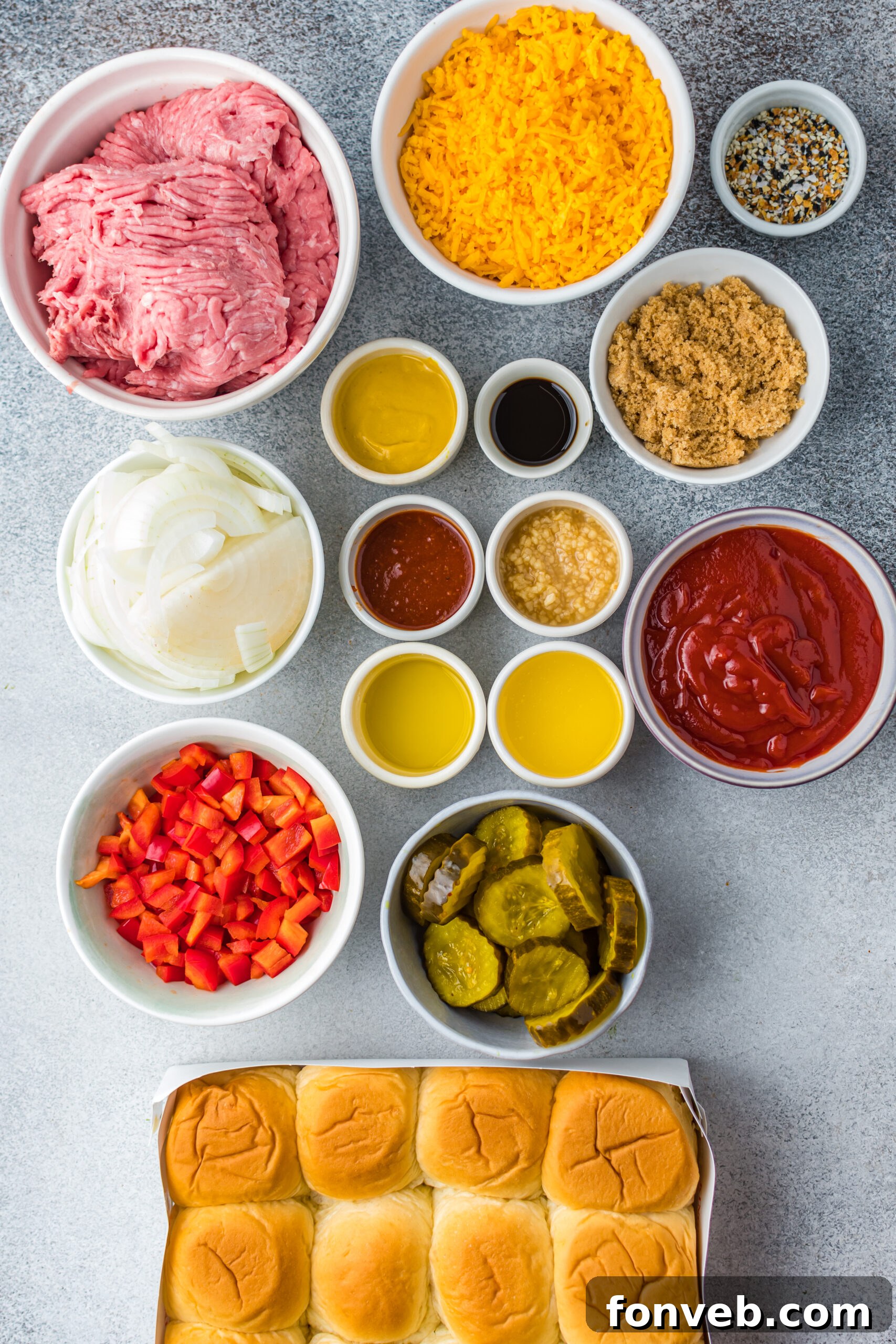 Overhead view of all the fresh, colorful ingredients needed to complete this delicious Cheesy Chicken Sloppy Joe Sliders recipe.