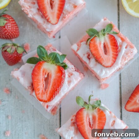 Finished Strawberry Lemon Brownies, neatly cut and glazed.