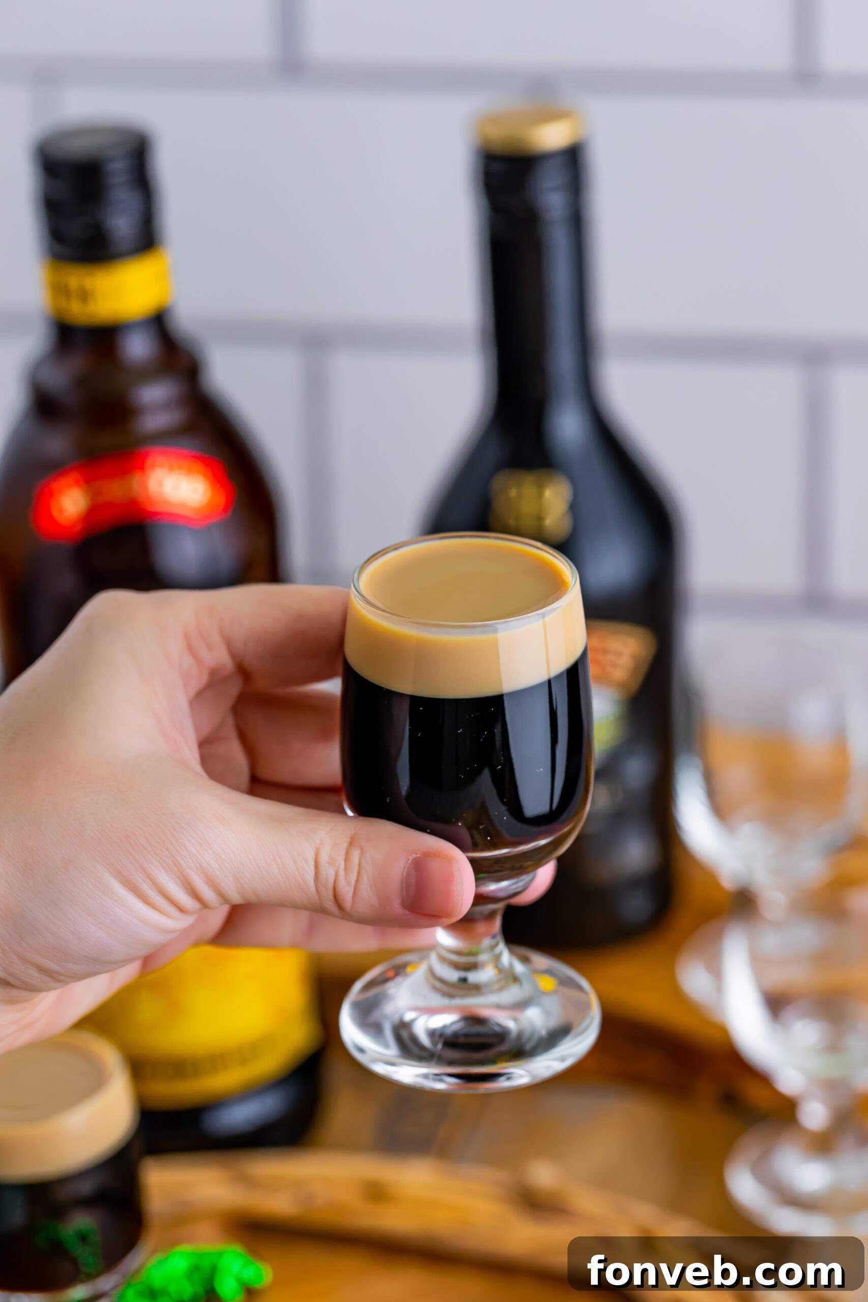 Mock Guinness Shots 11 A hand holding a baby Guinness Shot.