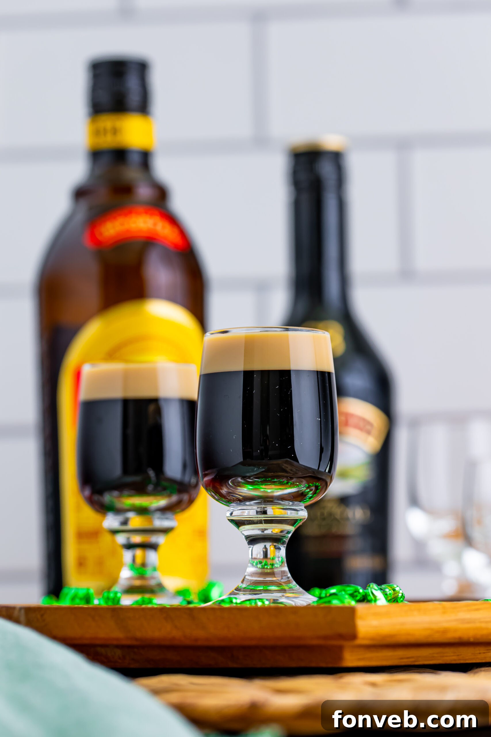 Mock Guinness Shots 13 Two Baby Guinness Shots on a wooden board with a green shamrock necklace.