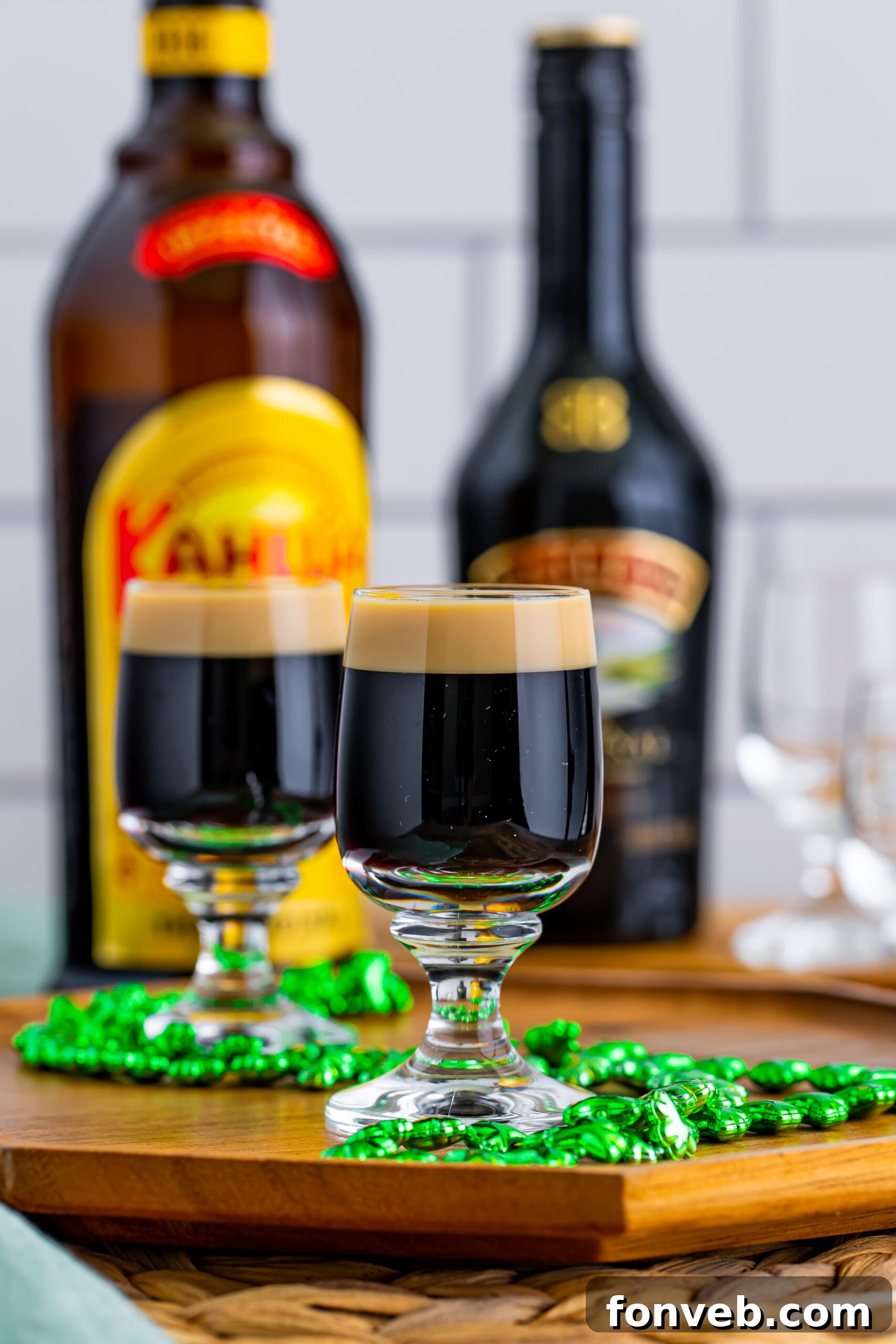 Mock Guinness Shots 3 Two Baby Guinness Shots on a wooden board with a green shamrock necklace.