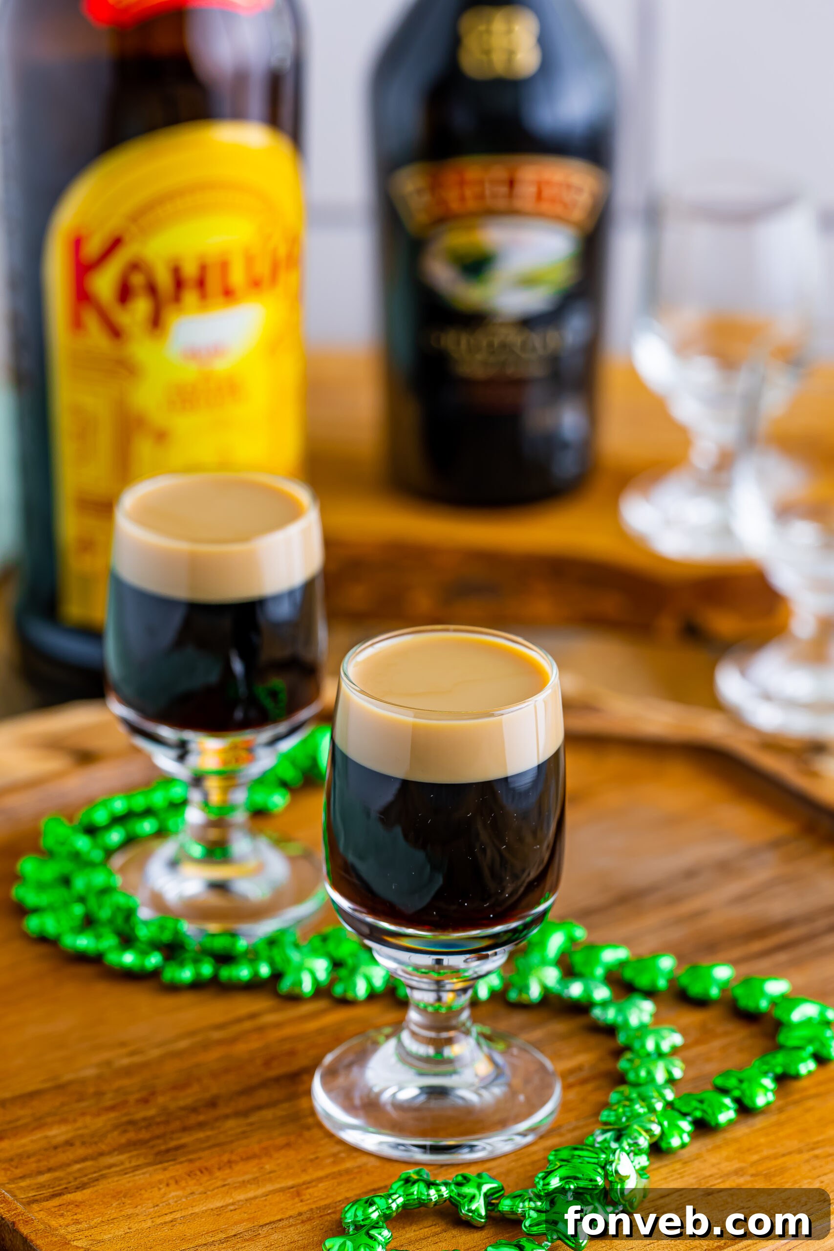 Mock Guinness Shots 9 Two Baby Guinness Shots on a wooden board with a green shamrock necklace.