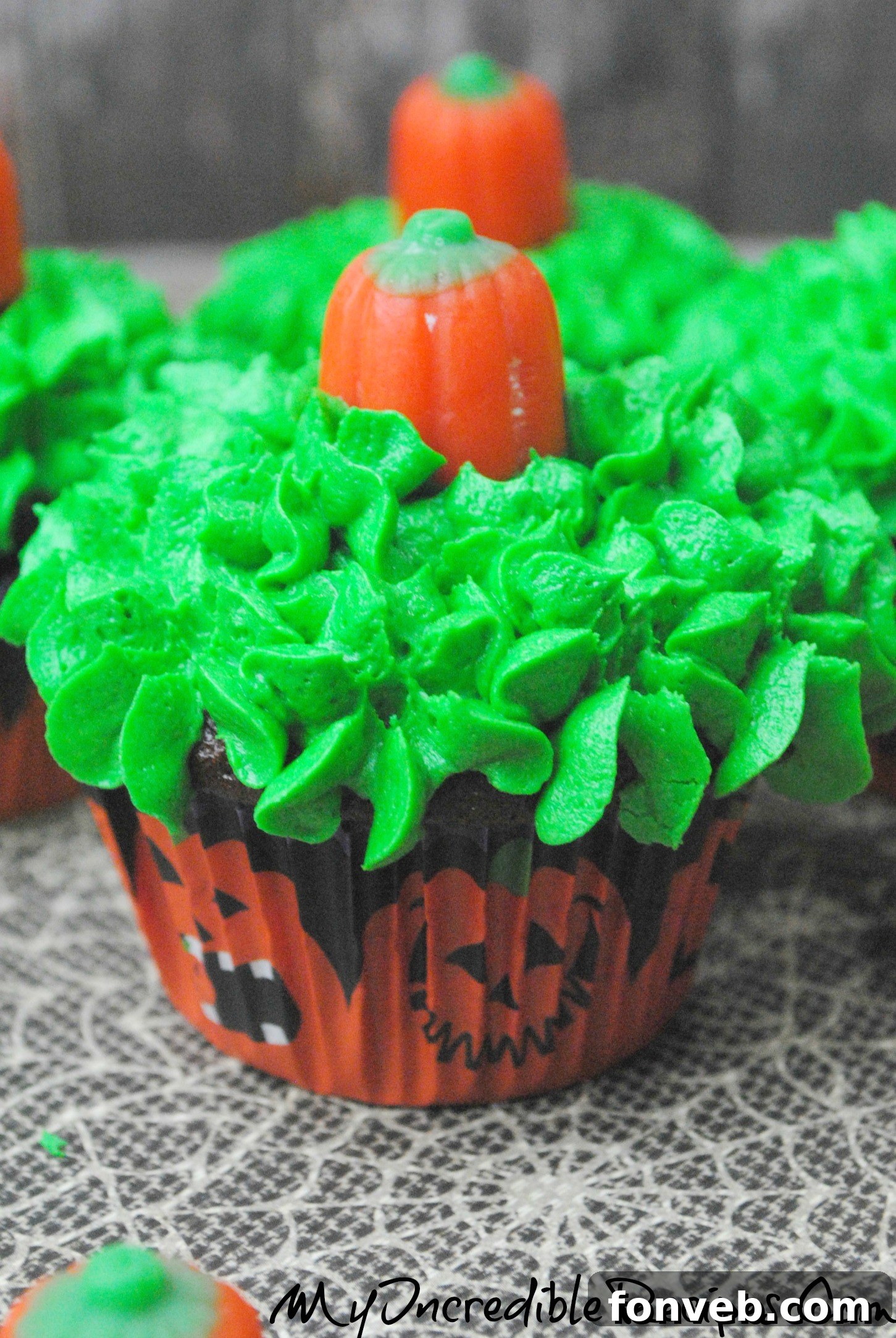 Autumn Pumpkin Patch Cupcakes 4 Variety of pumpkin patch cupcakes with green frosting and candy pumpkins