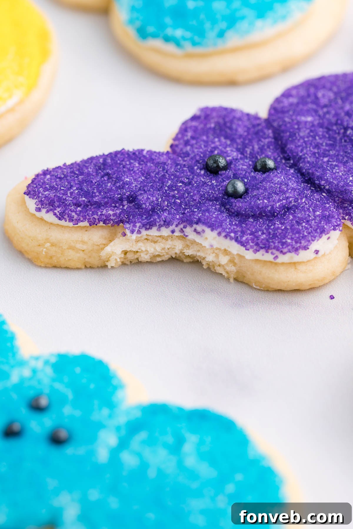 A purple Bunny Cookie with a small, neat bite taken out of its ear, indicating its delicious appeal.