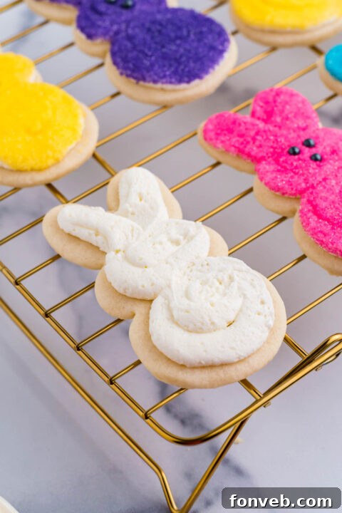 A Bunny Cookie freshly frosted with a generous layer of white icing, ready for colorful embellishments.