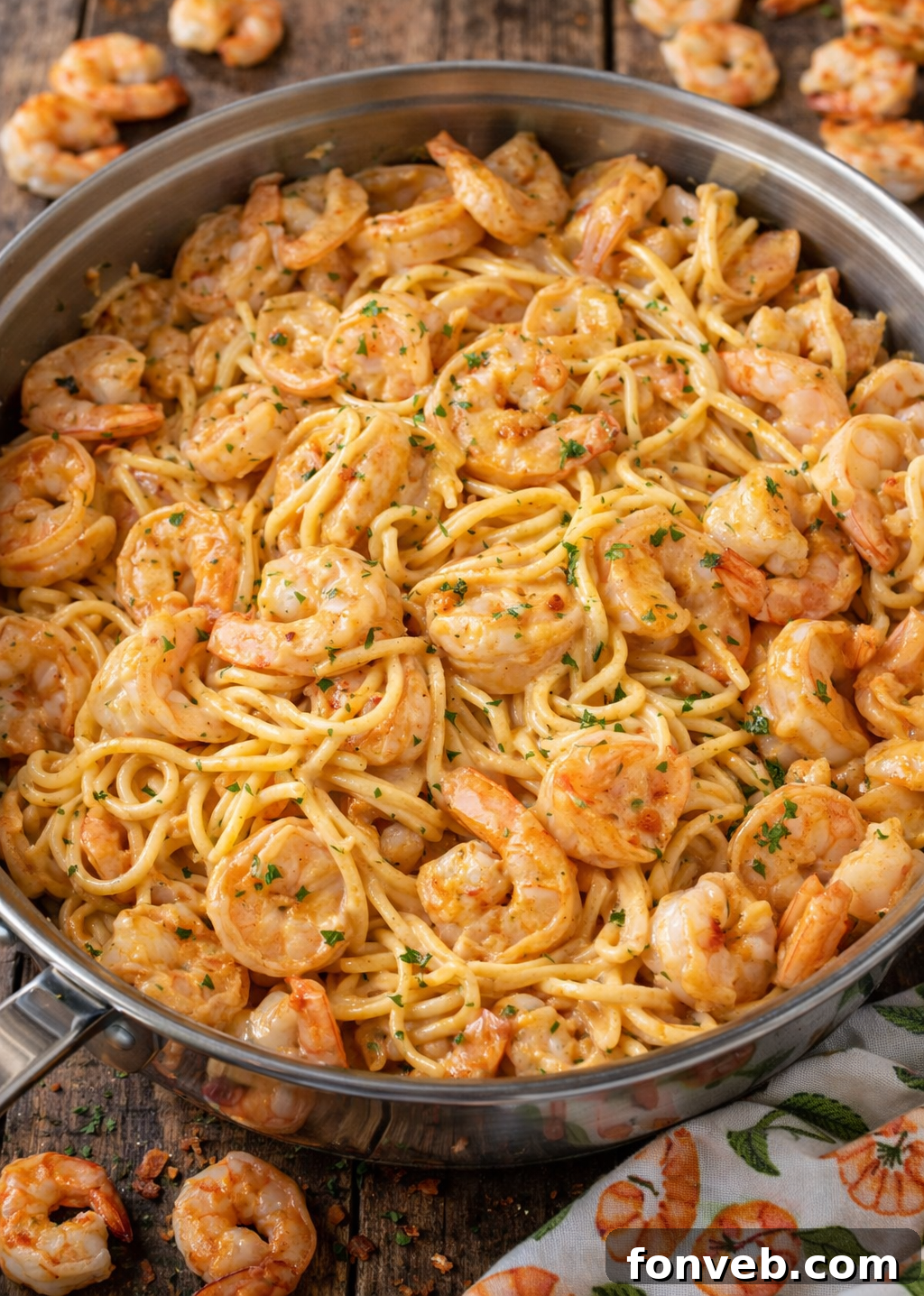 A serving of Bang Bang Shrimp Pasta, showcasing its creamy texture and fresh ingredients.