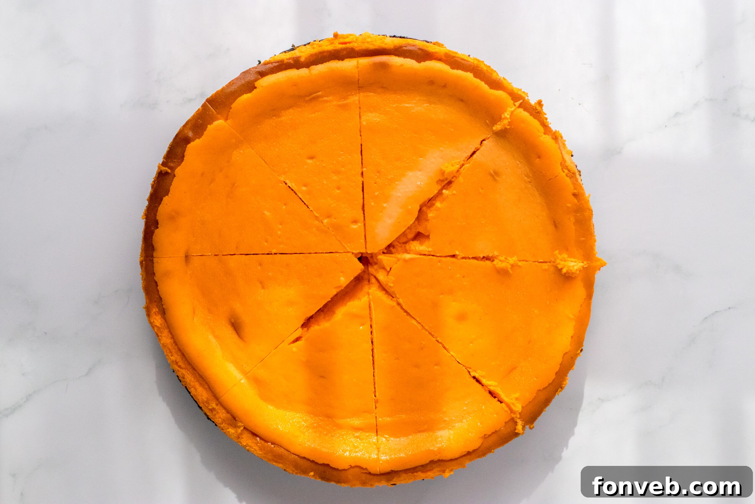 Orange food coloring being added to the cheesecake mixture, for that perfect carrot hue.