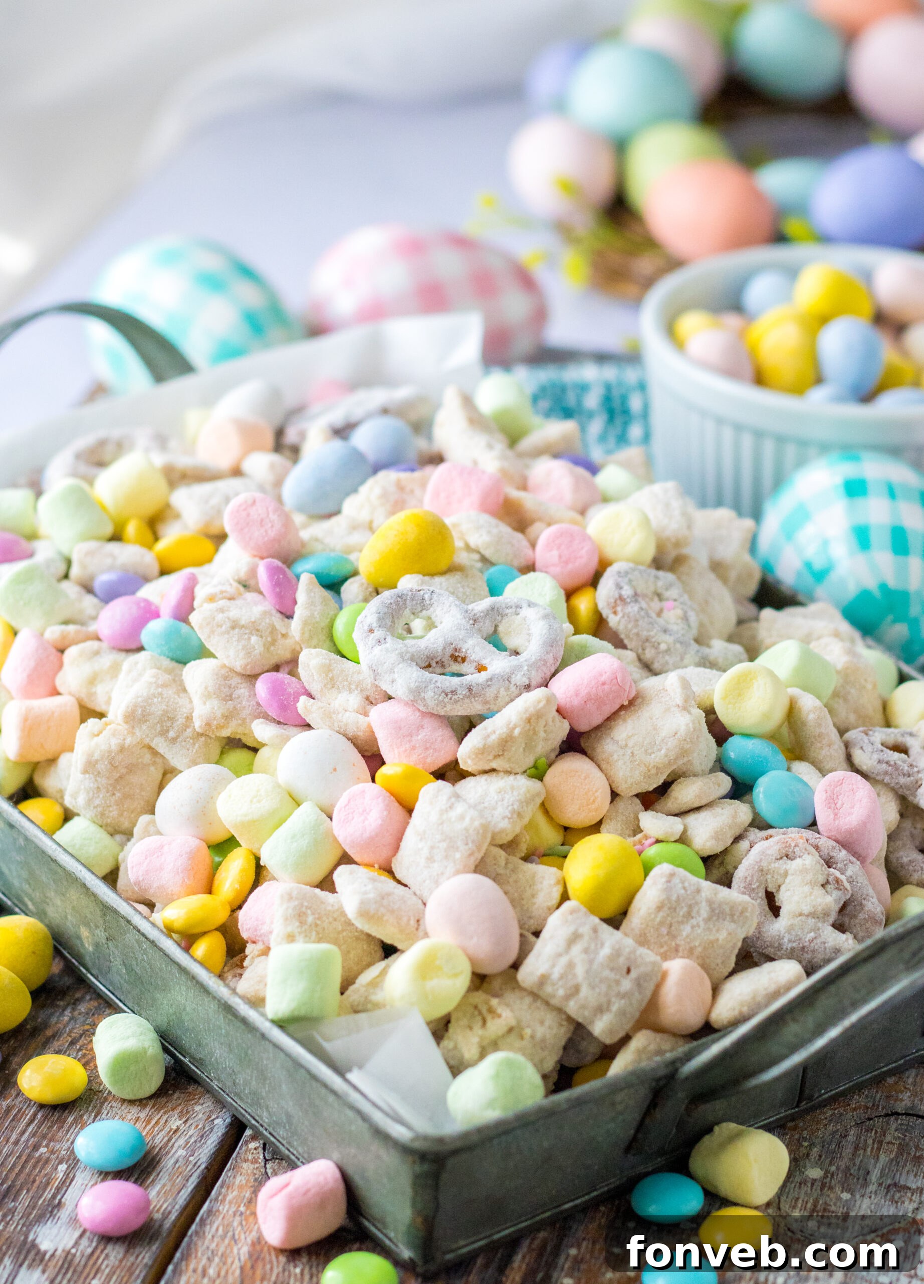 Bunny Munch in a silver serving tray, showcasing a mix of colorful candies, cereal, and pretzels.