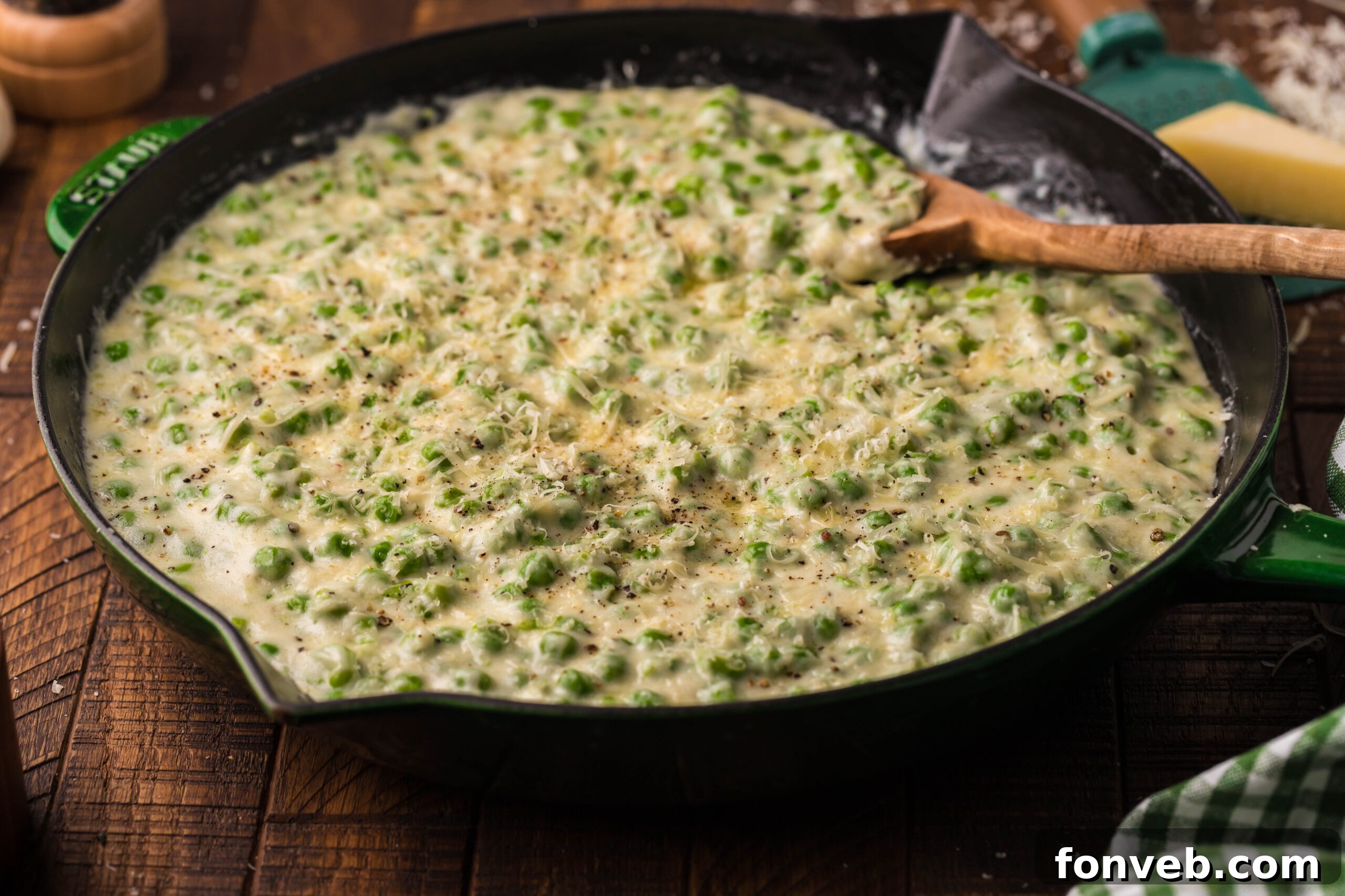 Creamed peas in a cast iron skillet.