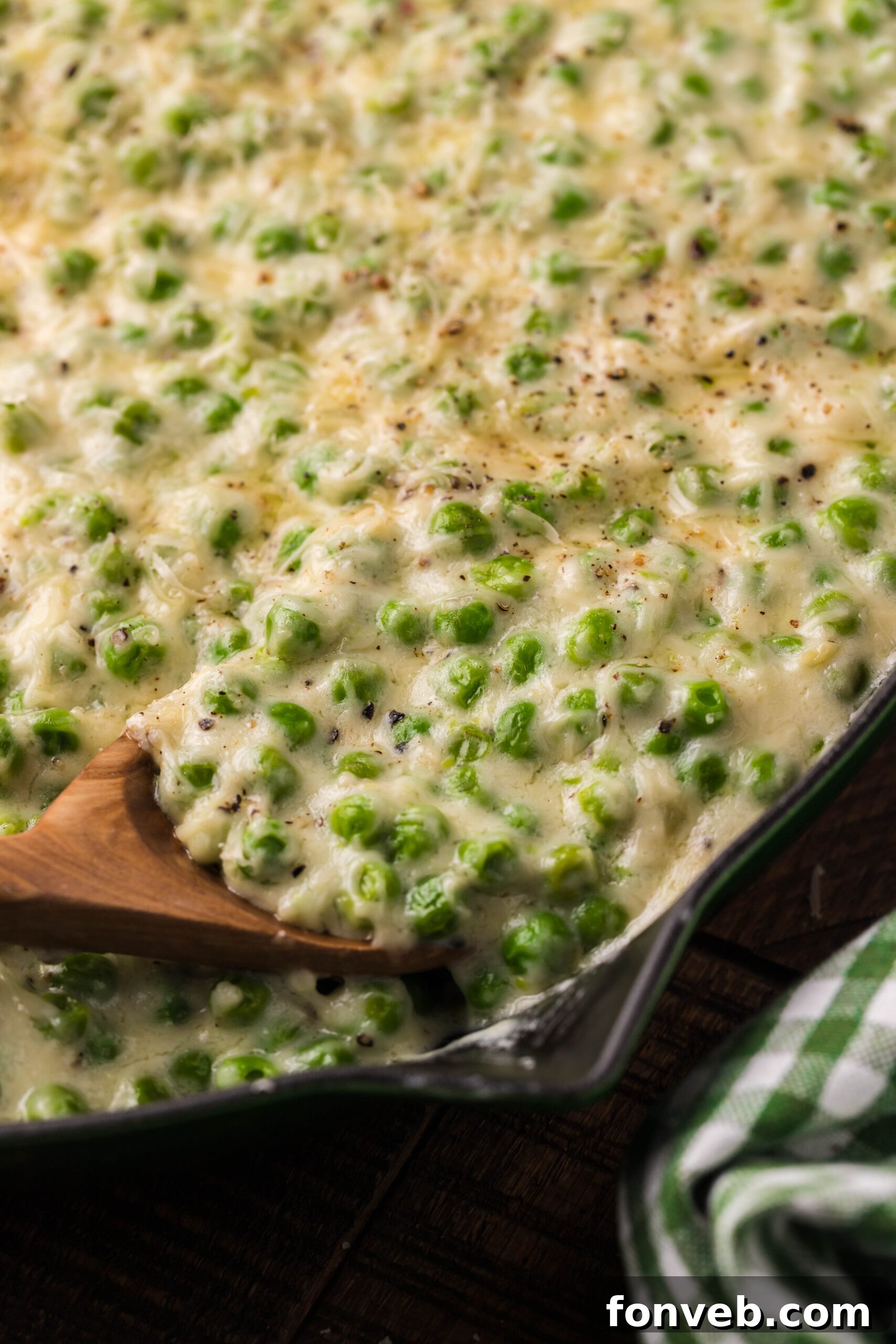 Creamed peas in a cast iron skillet.