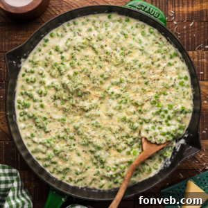Creamed Peas with a wooden spoon