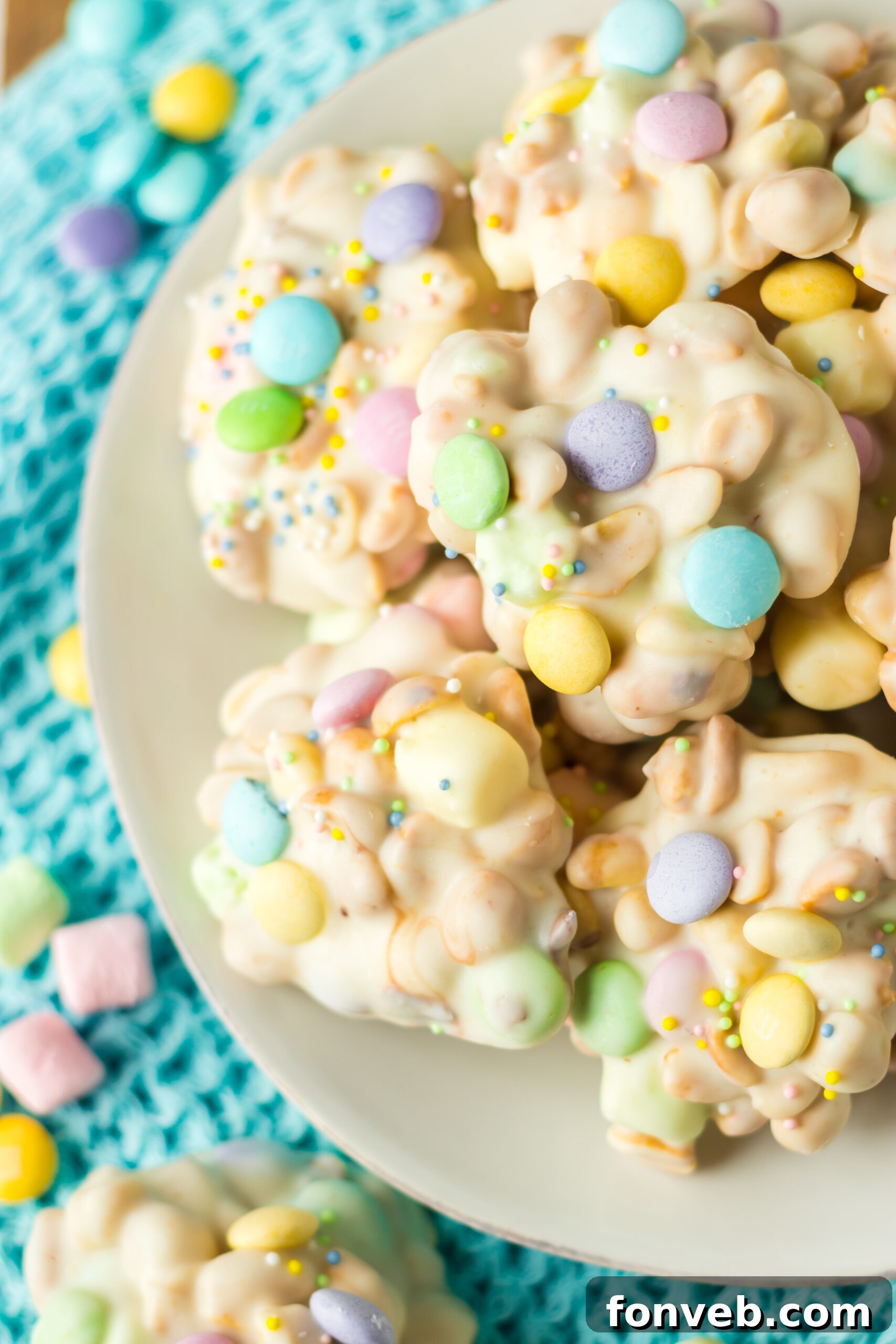 Slow Cooker Easter Candy on a white plate with a teal linen in the background