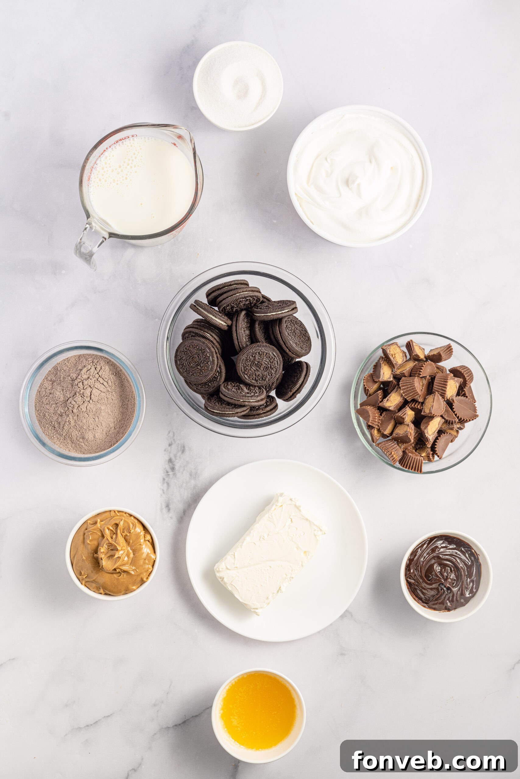 Reese's Peanut Butter Cup Lasagna 5 An organized overhead shot displaying all the essential ingredients for preparing the Reese's chocolate peanut butter lasagna, neatly arranged on a countertop.