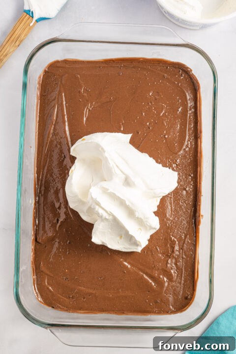 Reese's Peanut Butter Cup Lasagna 9 A bowl of prepared instant chocolate pudding, thick and ready for layering.