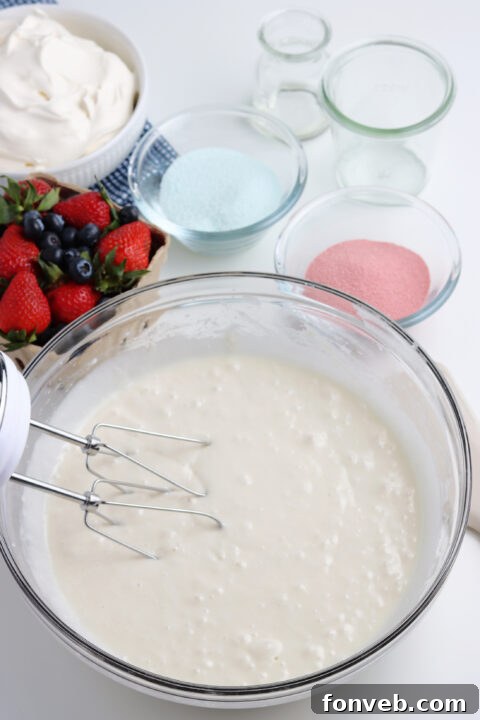 Cake batter spread evenly in a baking dish before baking.