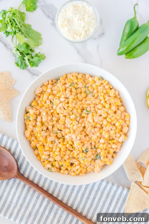 The colorful mix of chili powder, smoked paprika, cumin, and salt being sprinkled over the salad, adding depth of flavor.