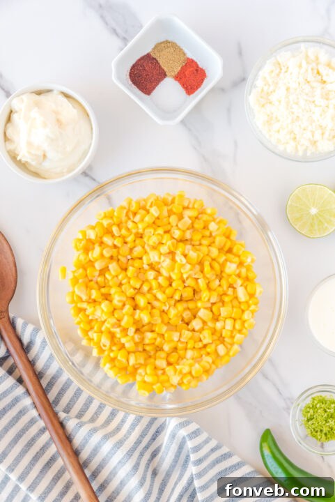 A vibrant, close-up shot of grilled corn kernels with rich butter, showing the beginning of the cooking process.