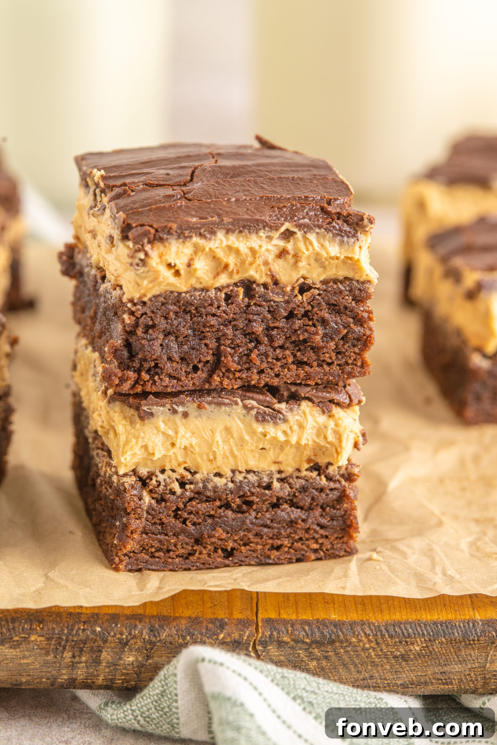 Two enticing Buckeye Brownies stacked neatly, ready to be enjoyed.