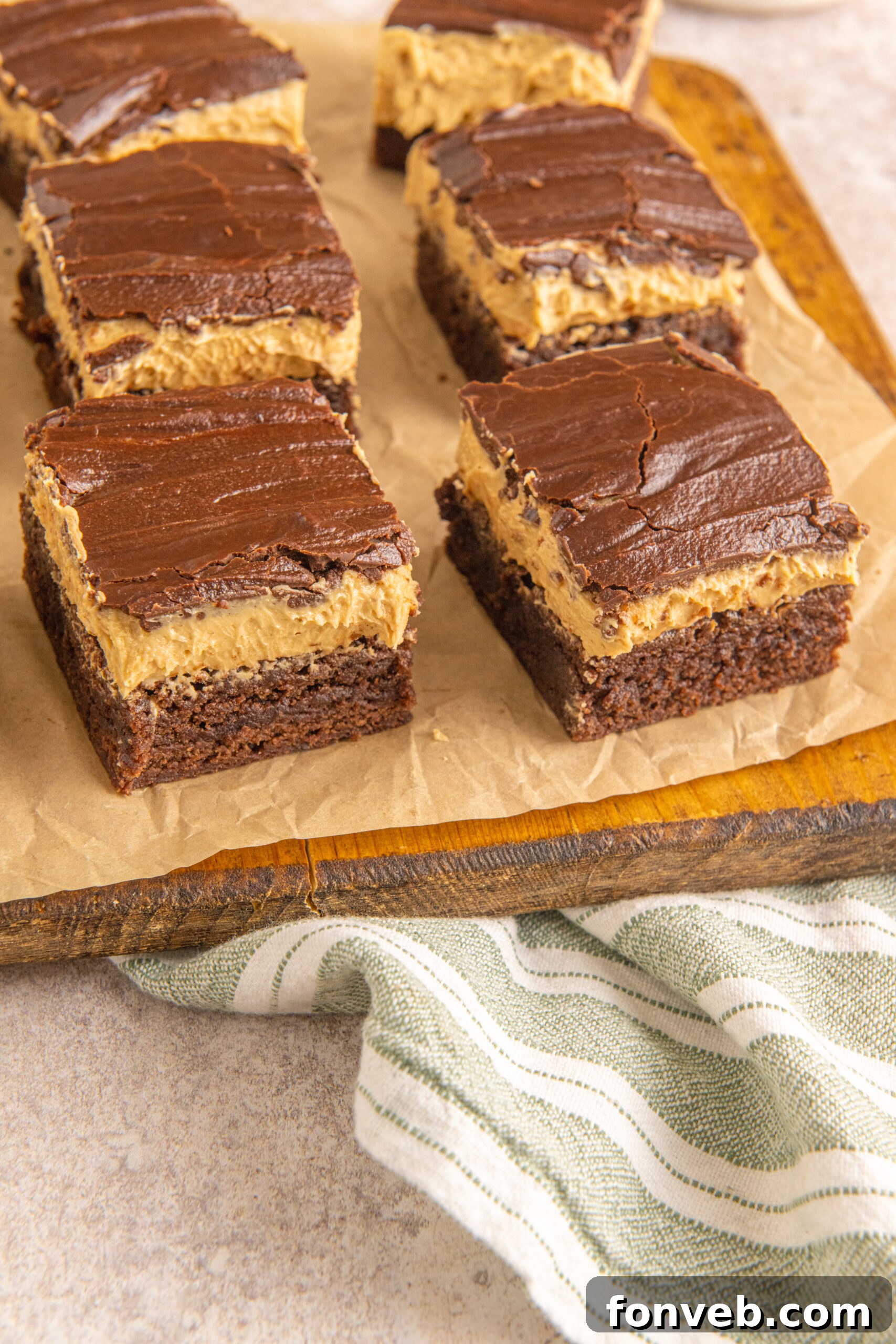 A delectable side view of Buckeye Brownies presented on a wooden board, ready for serving.