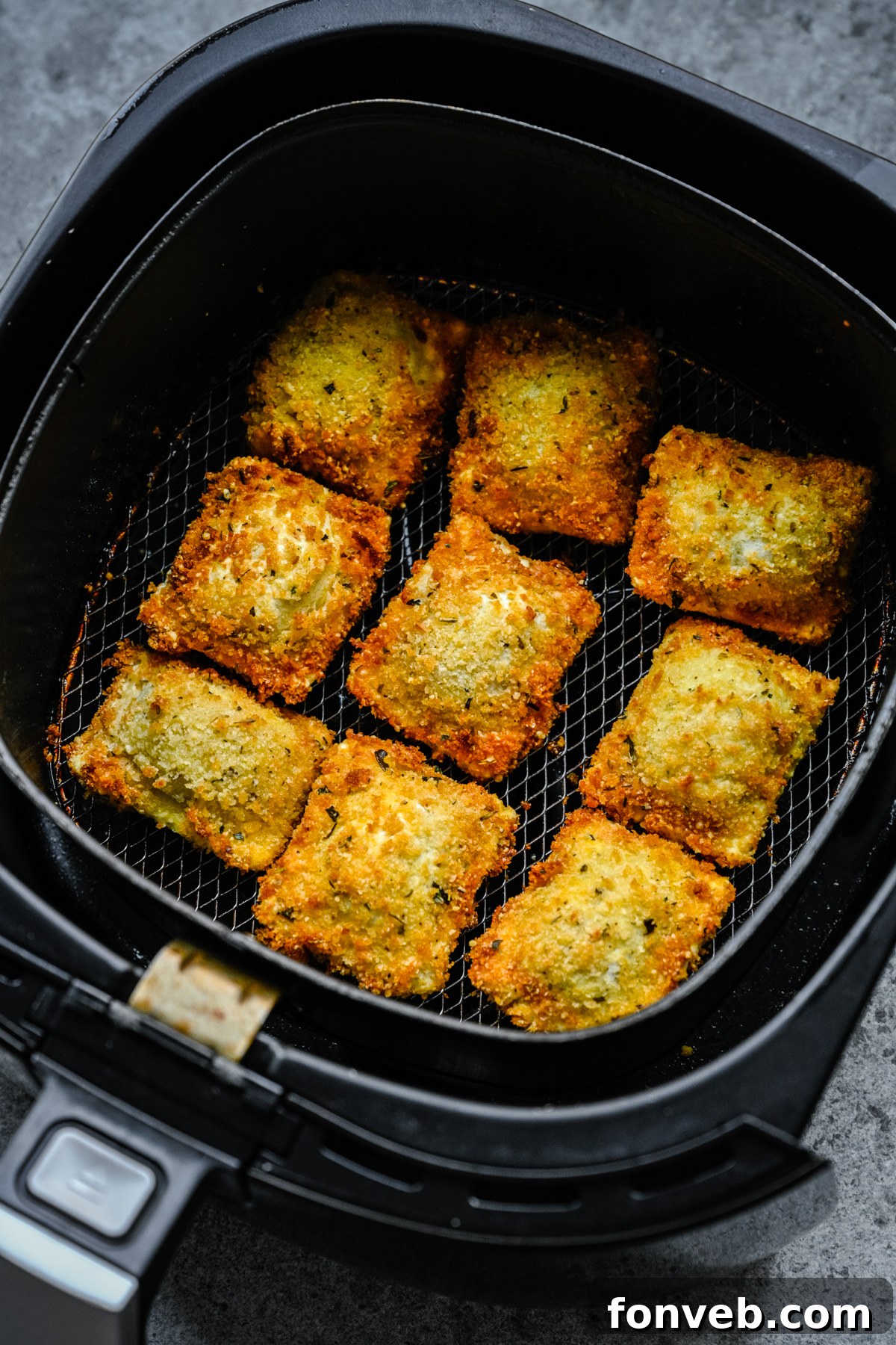 Air Fryer Ravioli in the air fryer basket. 