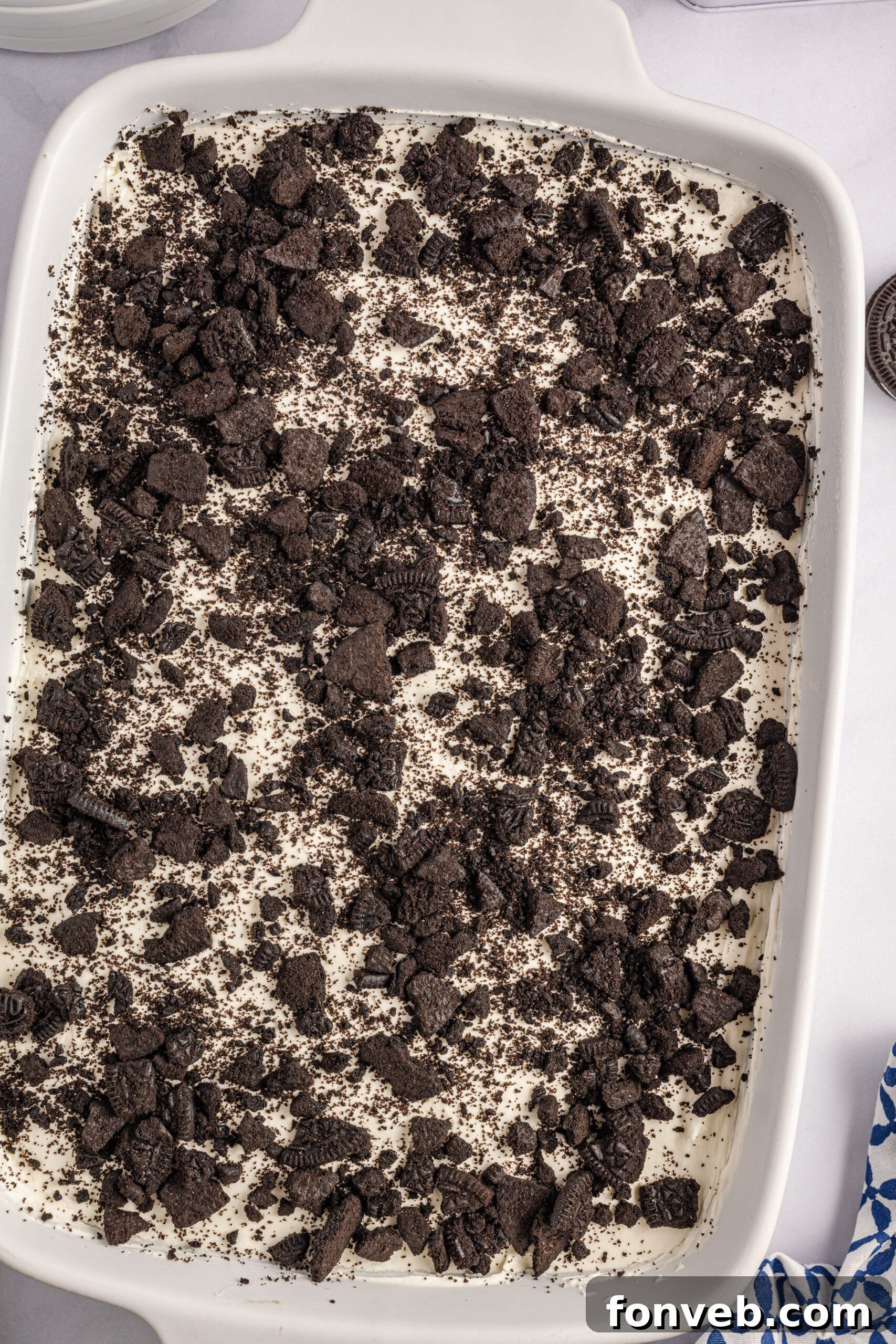Overhead view of Oreo Icebox Cake in a white baking dish.