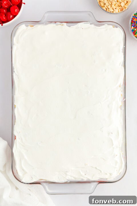 Crunchy chopped peanuts, adding a textural contrast to the soft dessert.