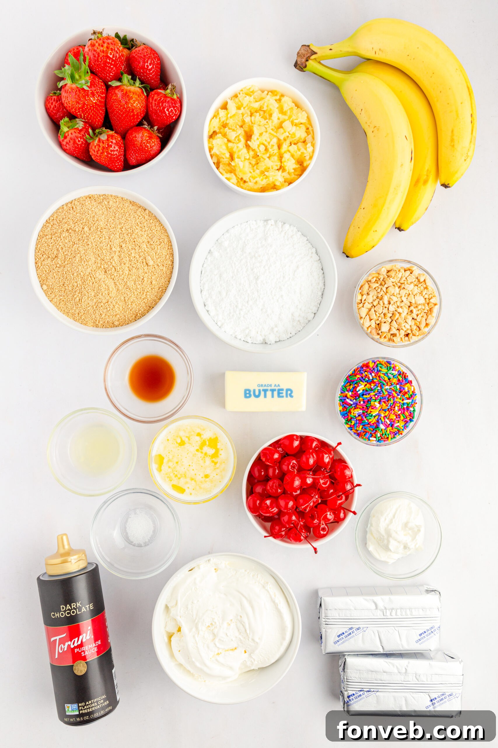 An overhead shot showcasing all the fresh and packaged ingredients neatly arranged for making the No-Bake Banana Split Cake recipe.