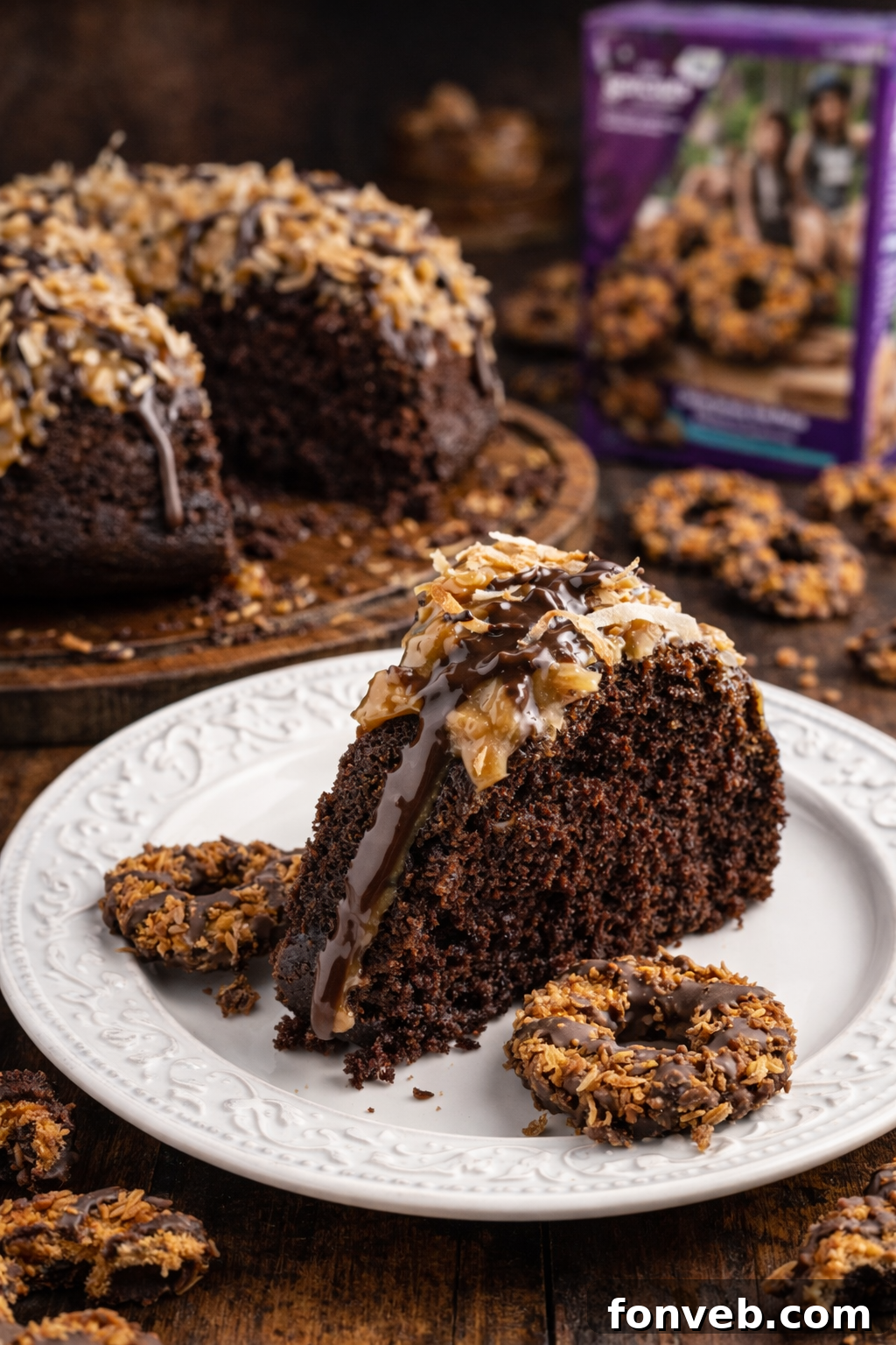 Samoa Cake slice on a pretty white plate on a dark table 