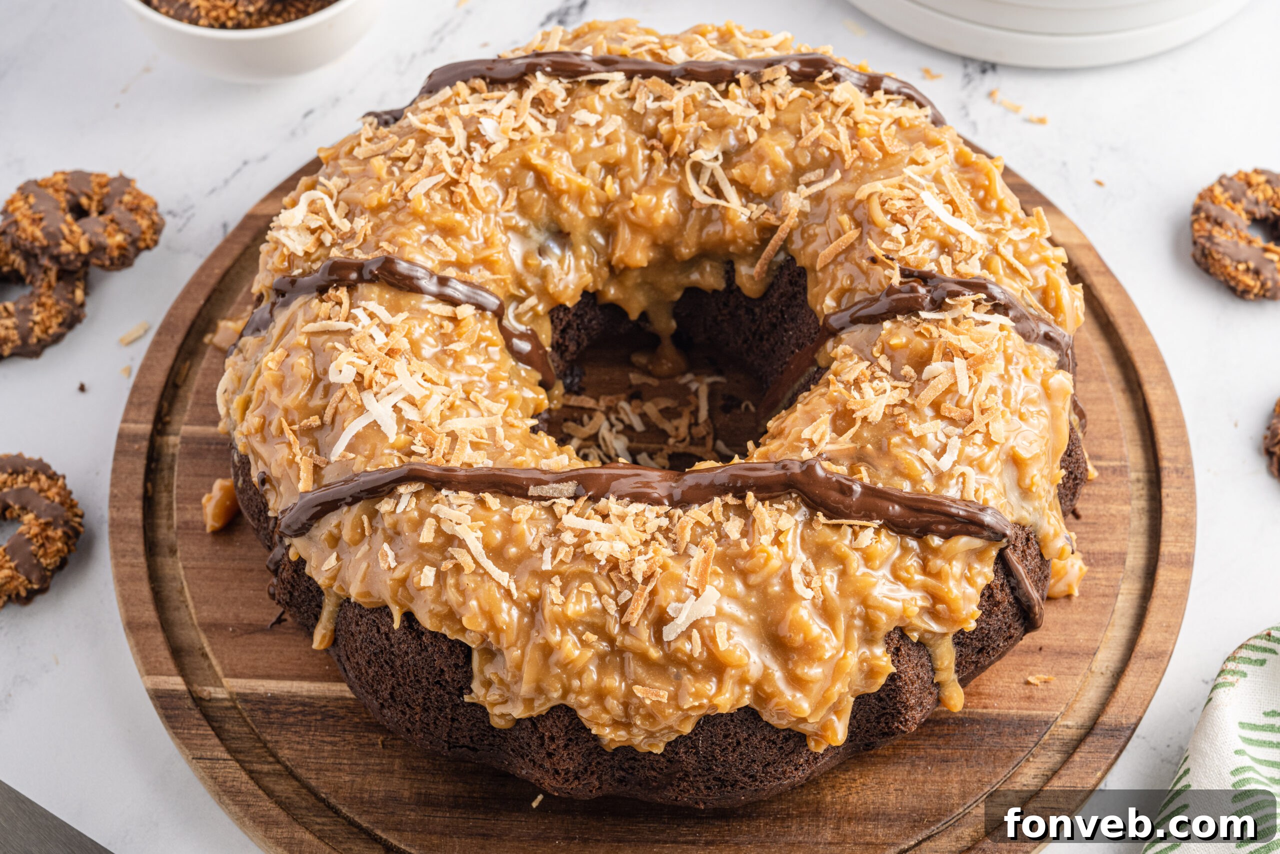 Overhead view of Samoa Cake on a wooden cutting board.