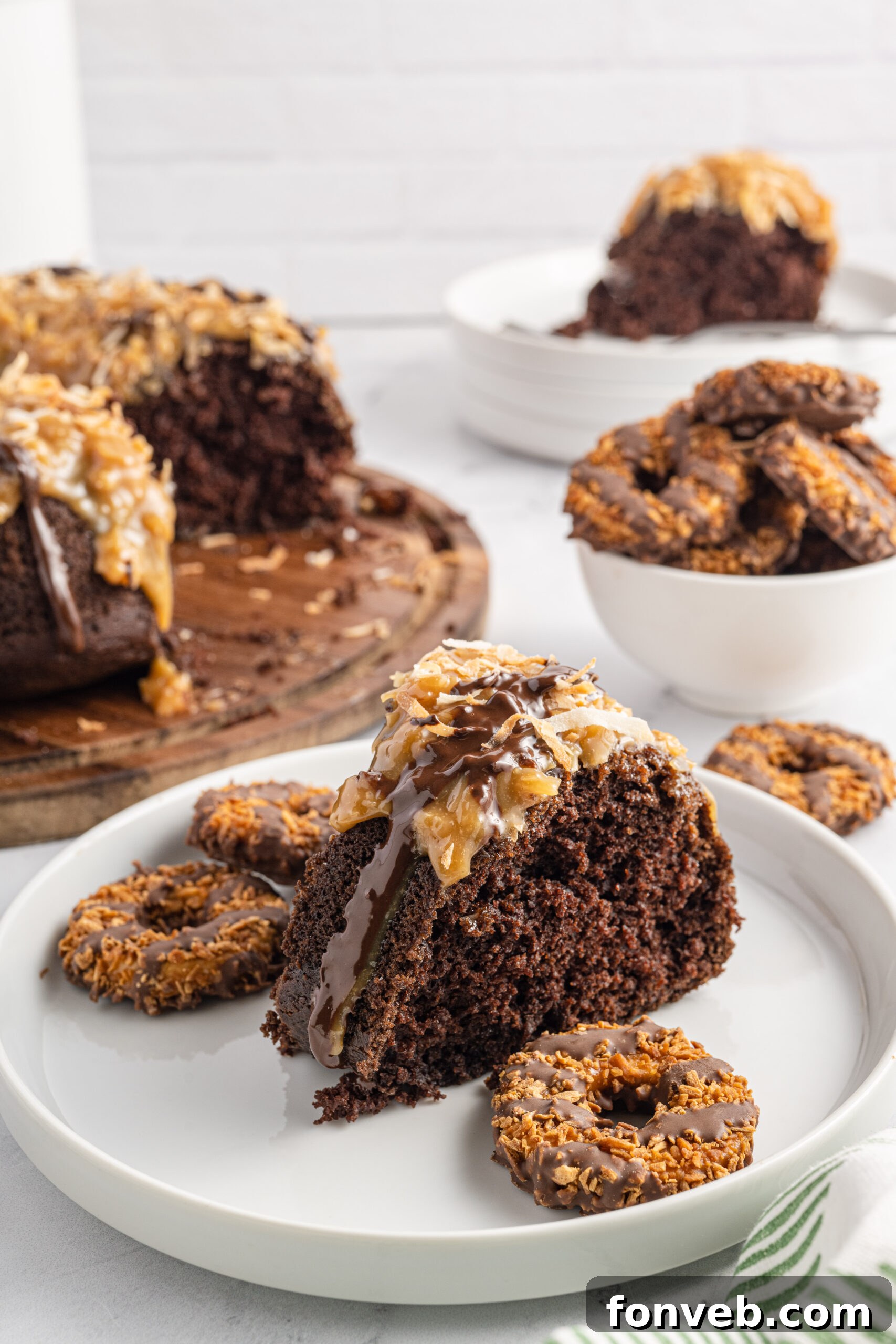 Front view of a slice of Samoa Cake on a white plate.