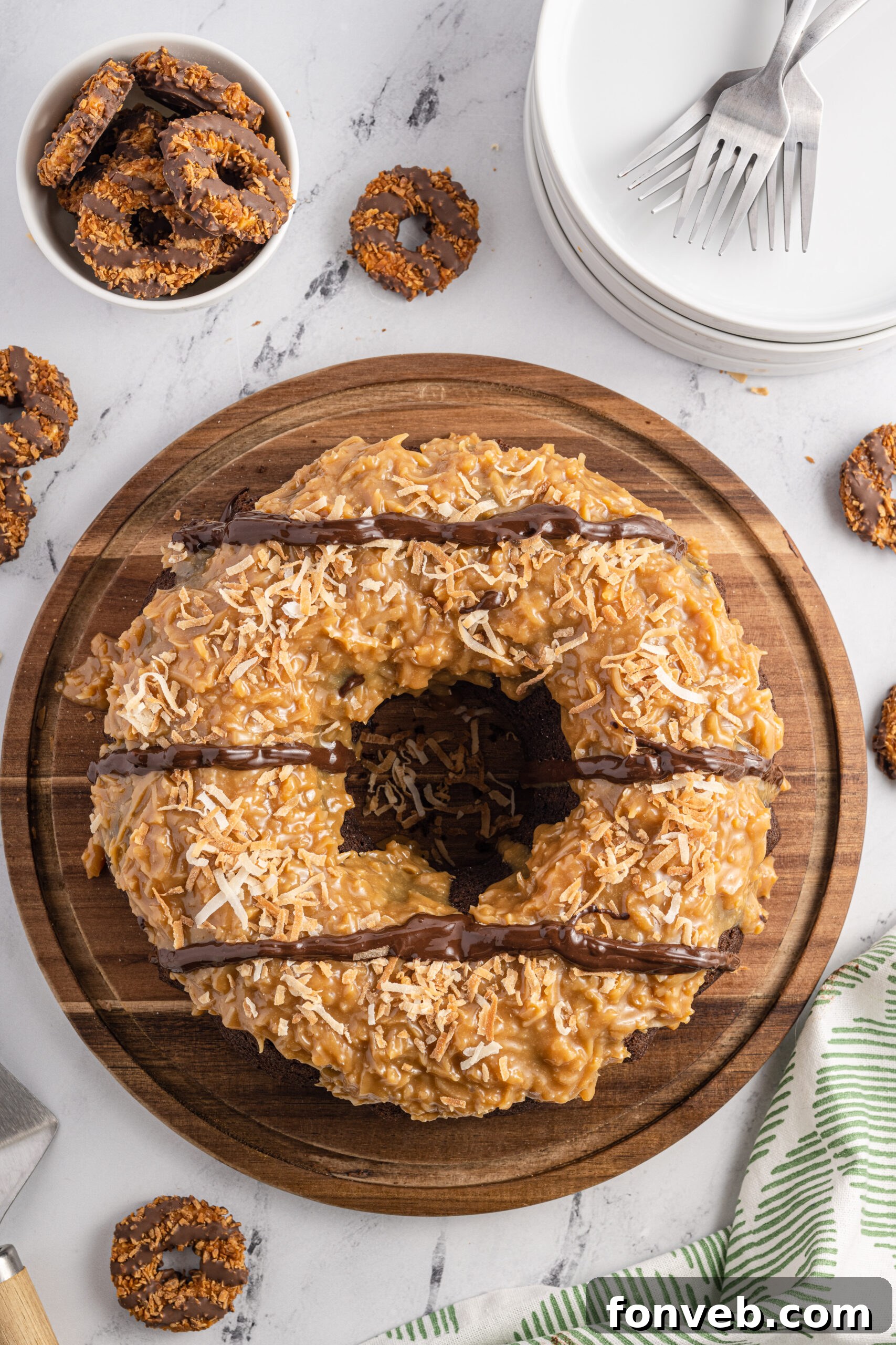 Overhead view of Samoa Cake on a wooden cutting board.