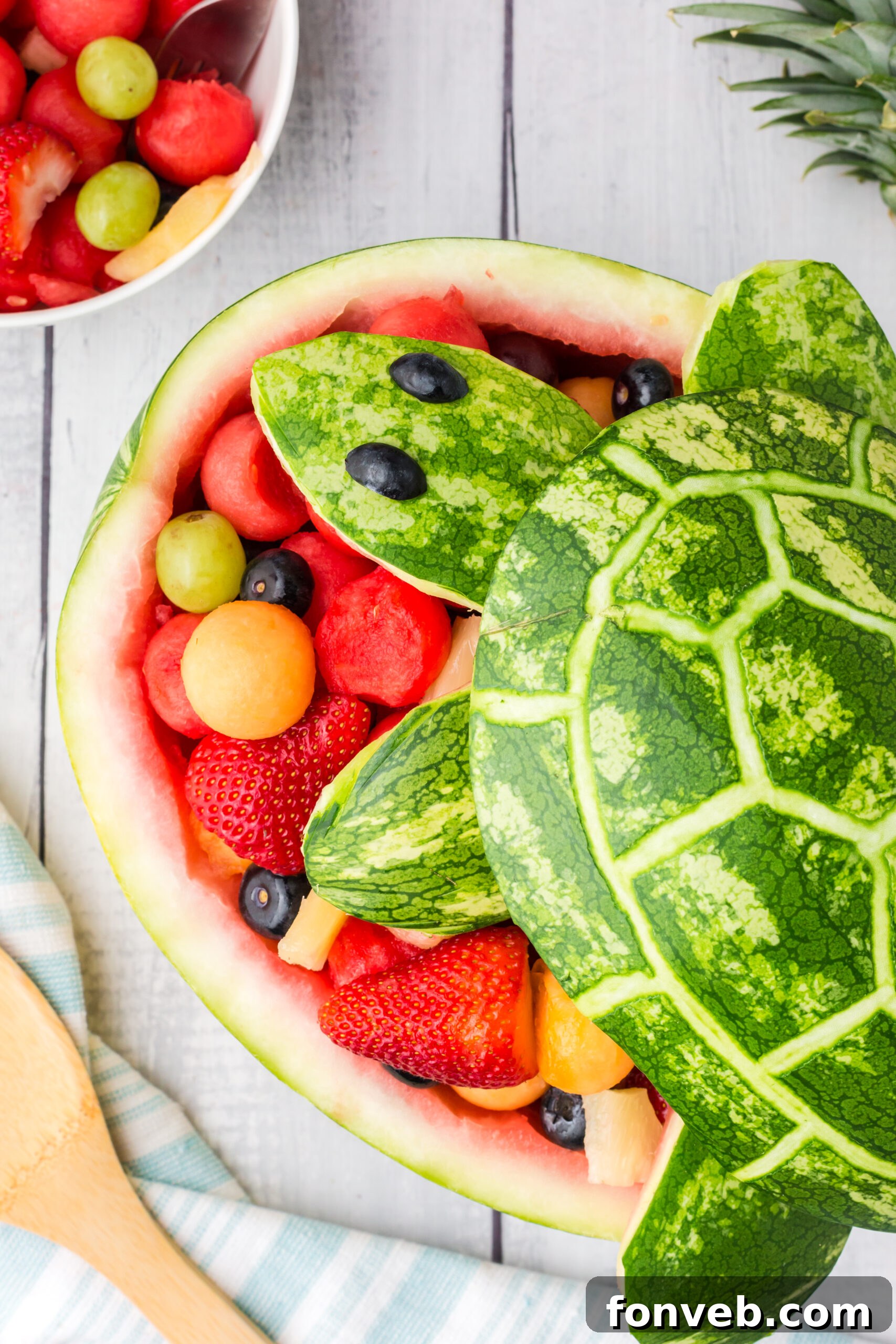Side view of the Watermelon Turtle Fruit Salad, placed against a vibrant background to emphasize its colors.