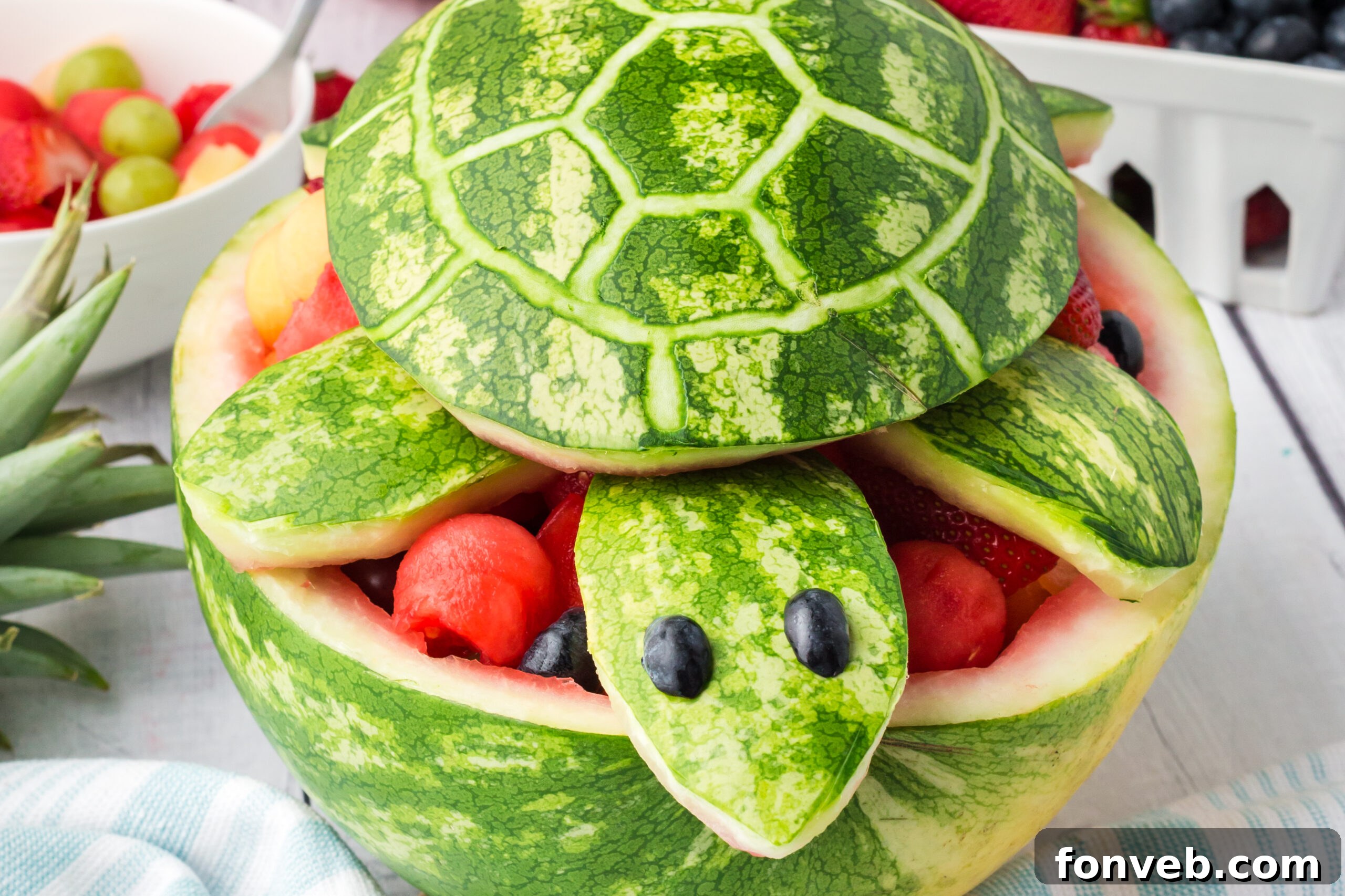 Front view of the adorable Watermelon Turtle Fruit Salad, ready to be served at a summer party.