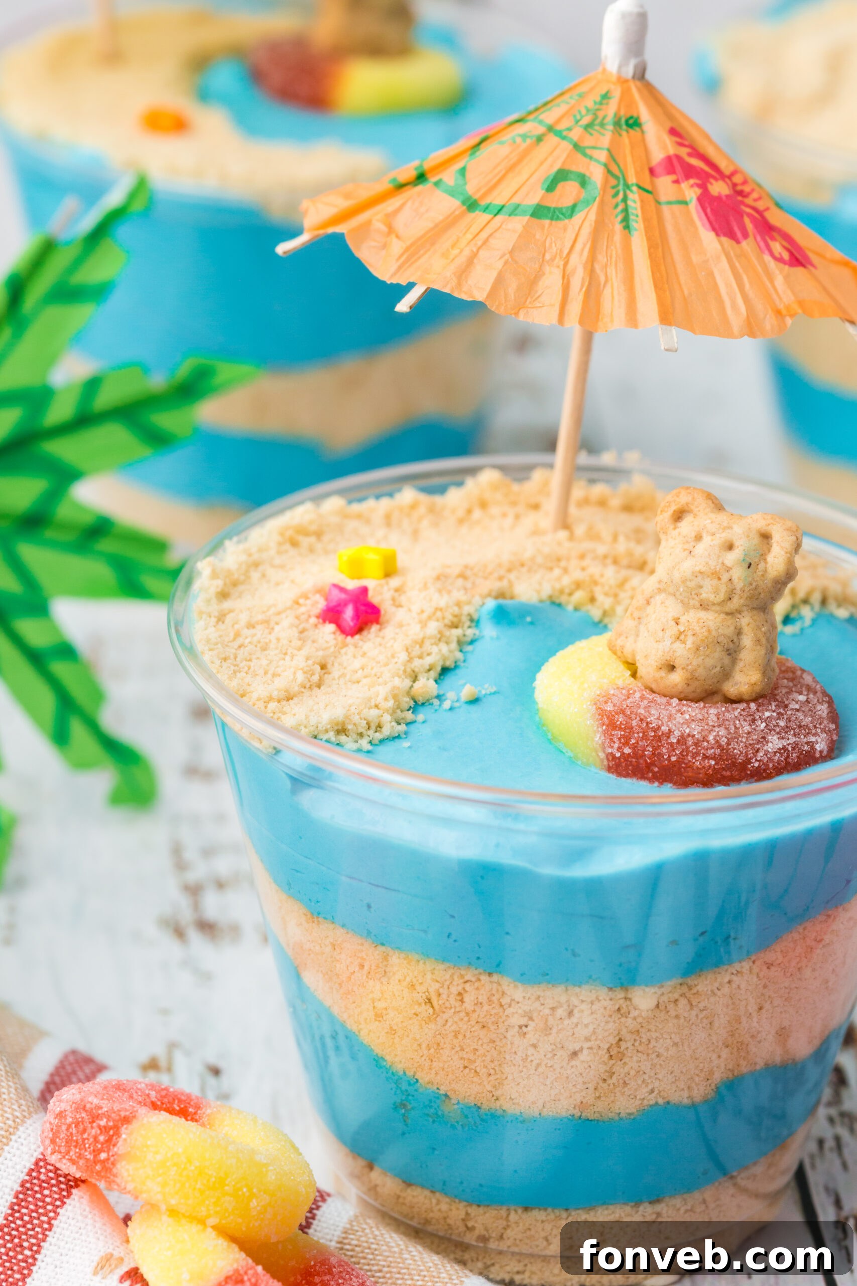 Front view of a perfectly crafted Beach Cheesecake Pudding Cup with all its charming decorations.