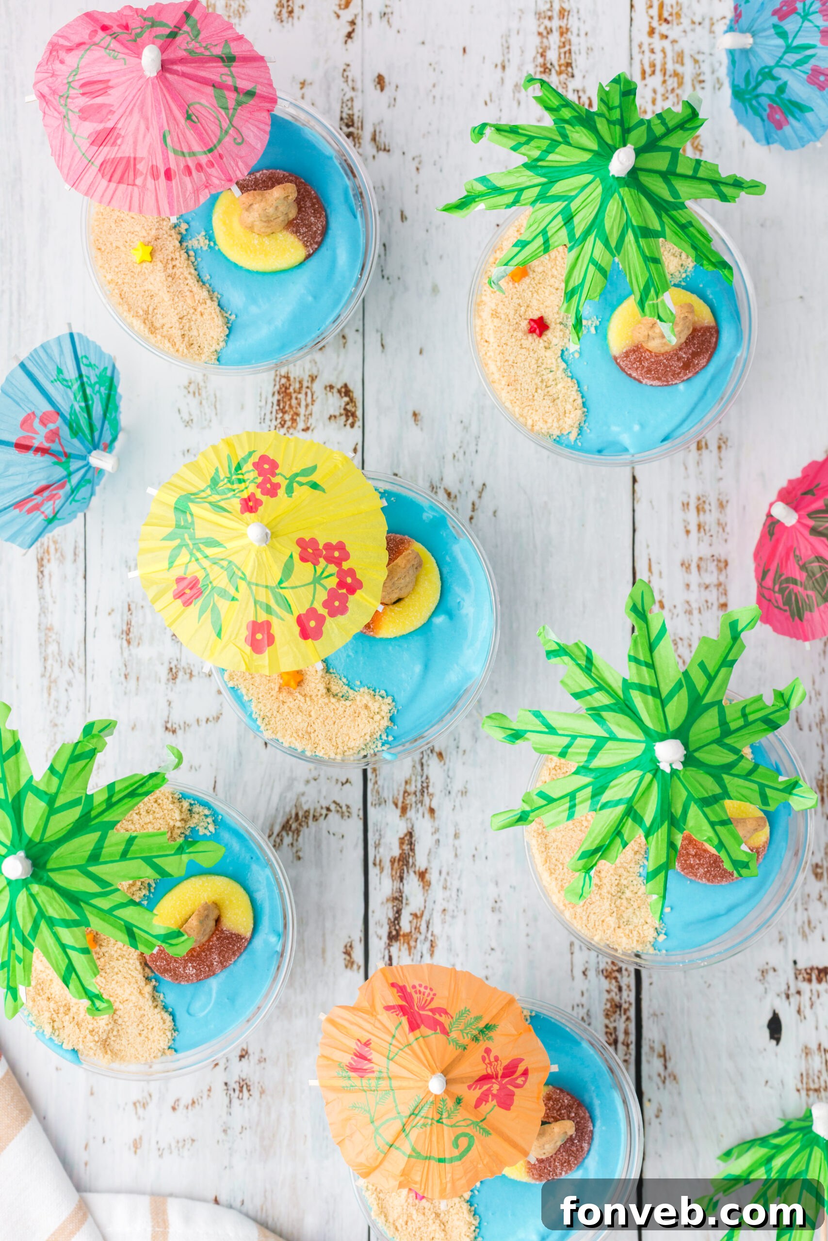 Overhead view of Beach Cheesecake Pudding Cups with adorable gummy decorations.
