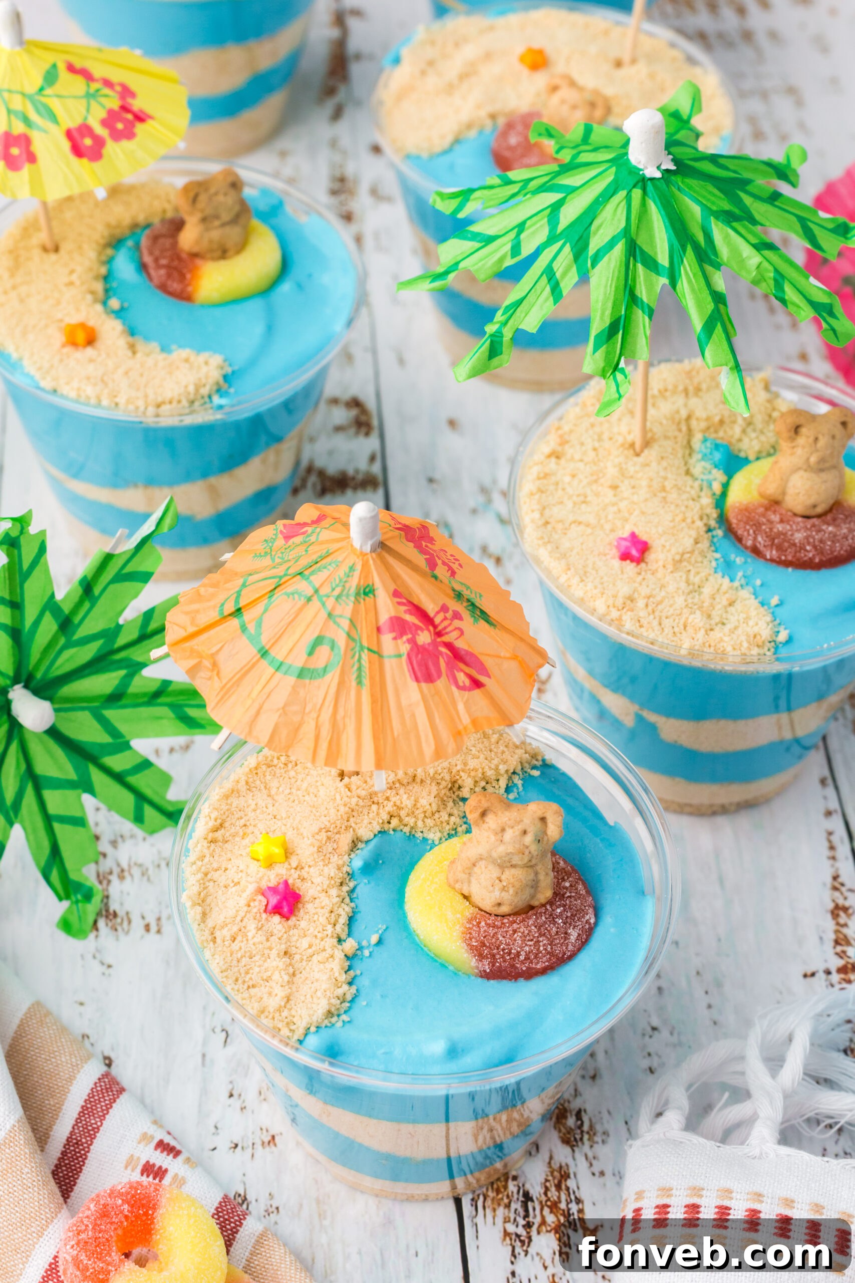 Overhead view of beautifully decorated Beach Cheesecake Pudding Cups, ready to serve.