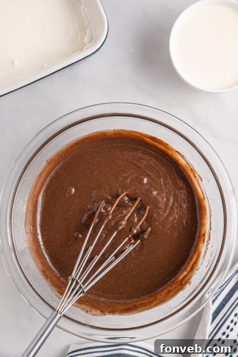 Cream cheese layer spread evenly over the Oreo crust.