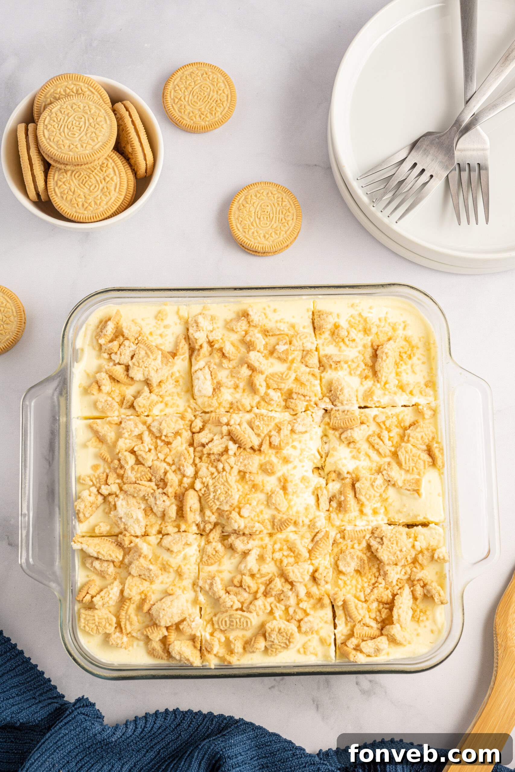 Golden Oreo No-Bake Delight 3 Overhead view of Golden Oreo Icebox Cake in a clear baking dish.