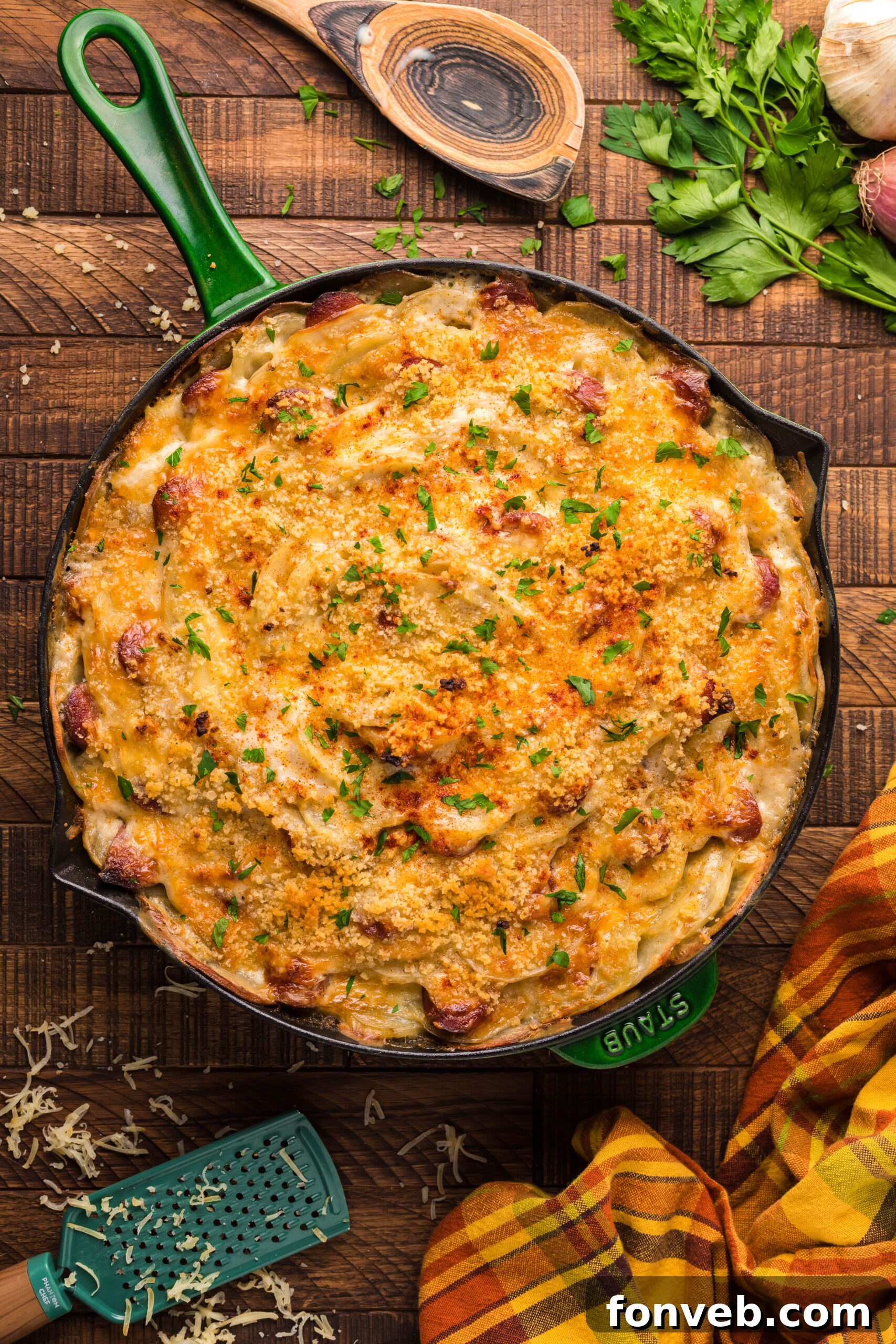 Creamy Sausage and Potato Gratin 3 Overhead view of Au Gratin Potatoes & Ham in a cast iron skillet.