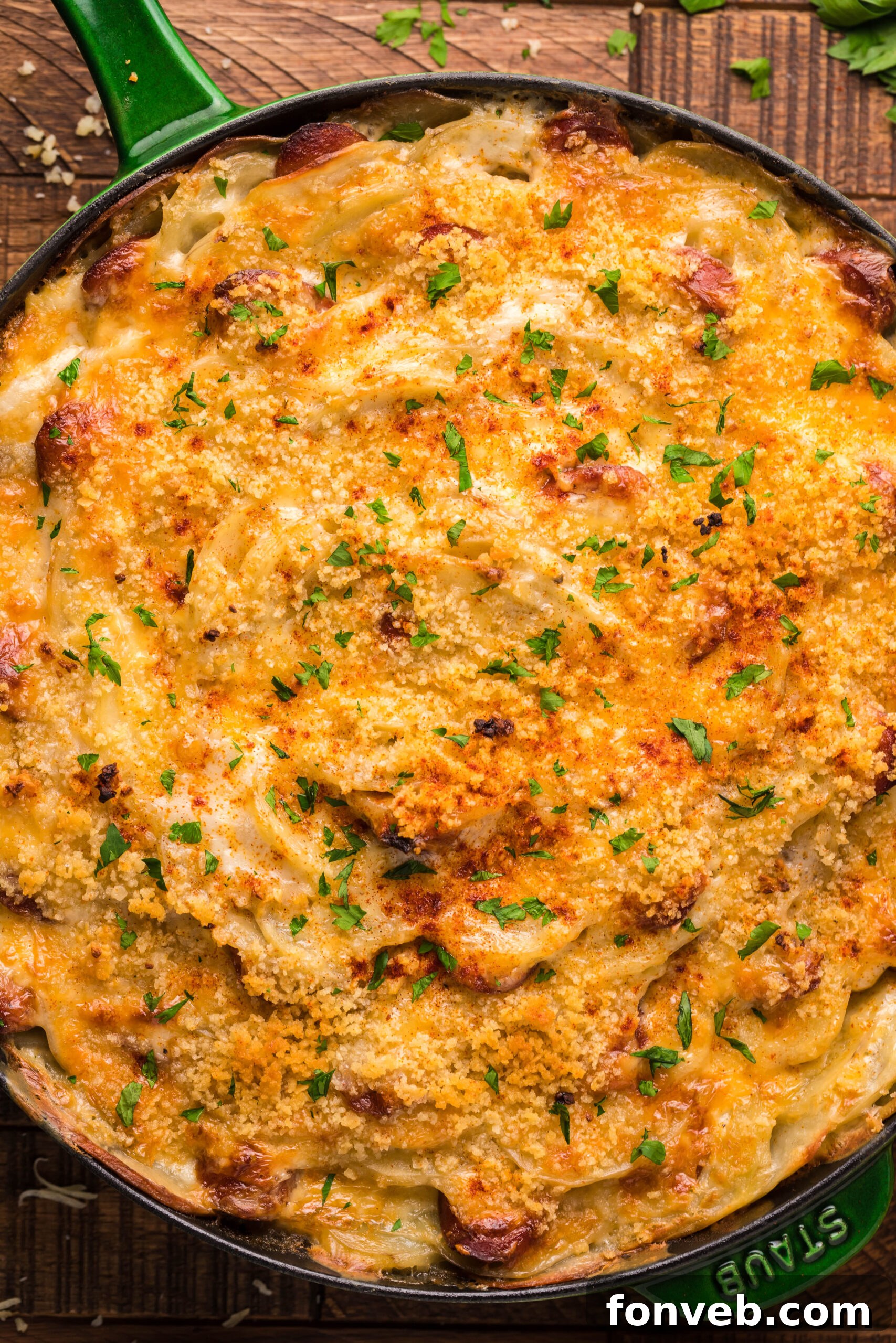 Creamy Sausage and Potato Gratin 5 Overhead view of Au Gratin Potatoes & Ham in a cast iron skillet.