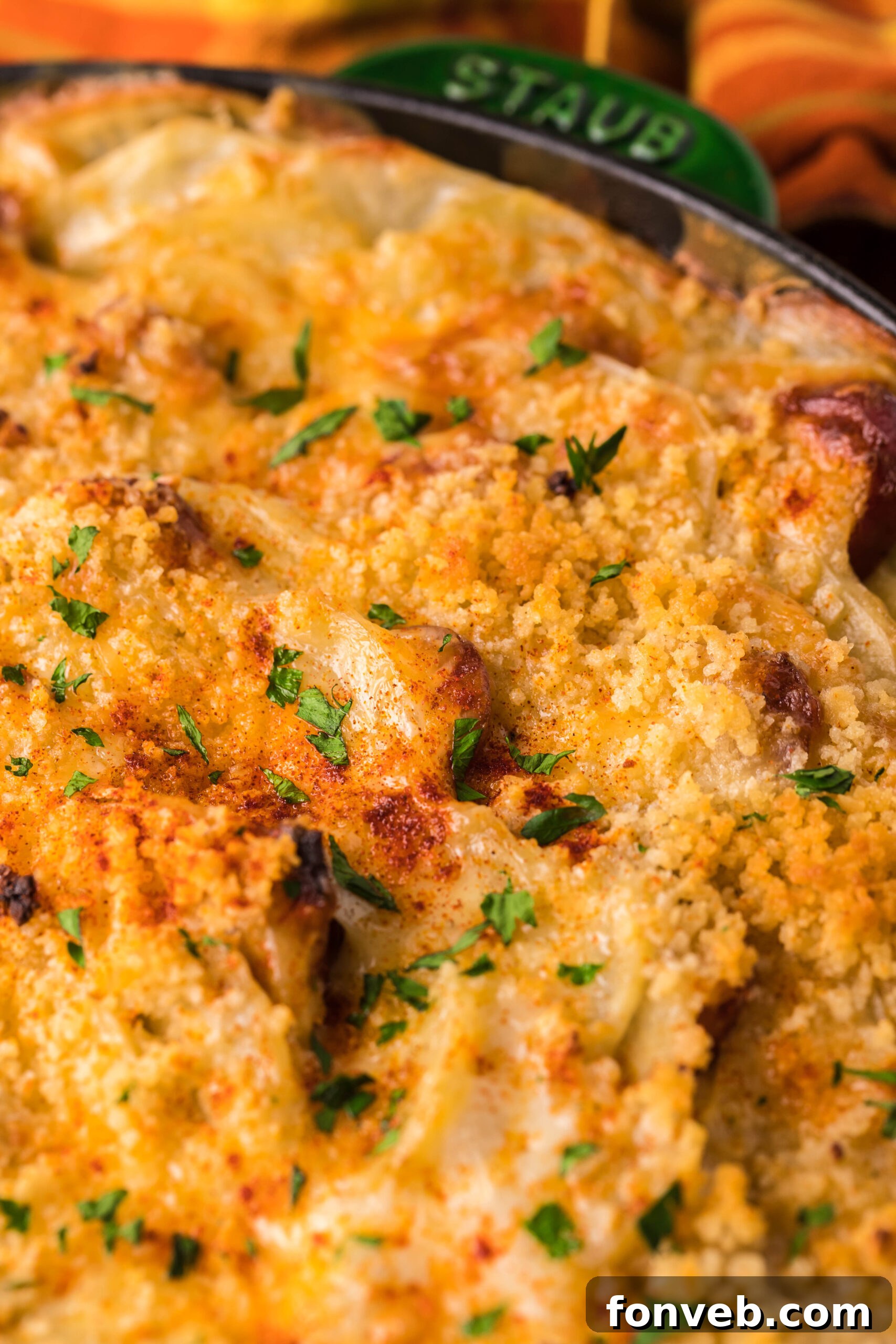 Creamy Sausage and Potato Gratin 10 Close up view of Au Gratin Potatoes & Ham in a cast iron skillet.